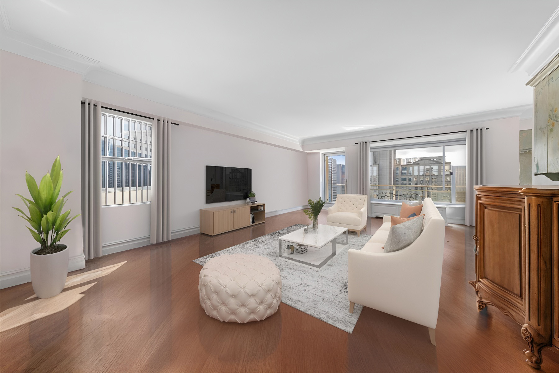 a living room with furniture a flat screen tv and a large window