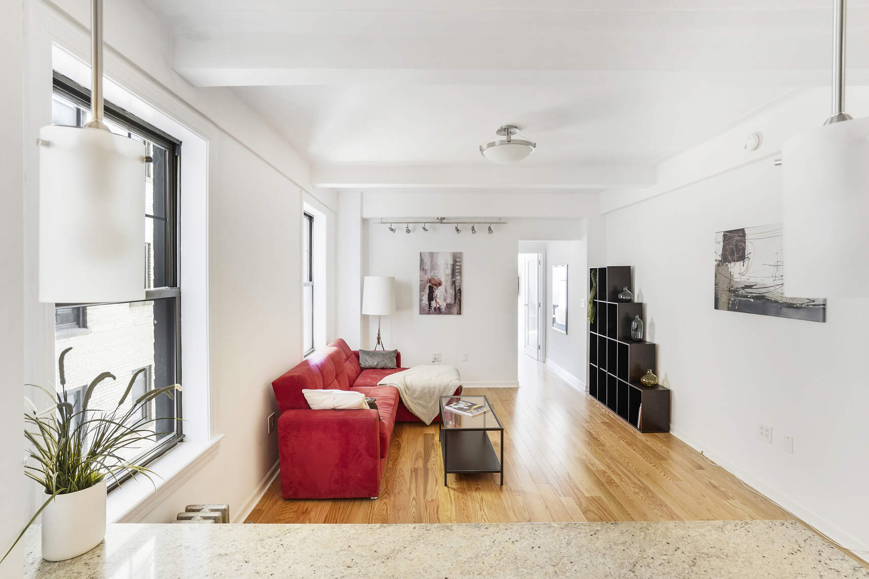 a living room with furniture bathtub and a flat screen tv