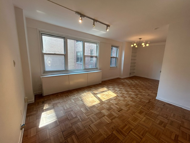 a view of an empty room with a window