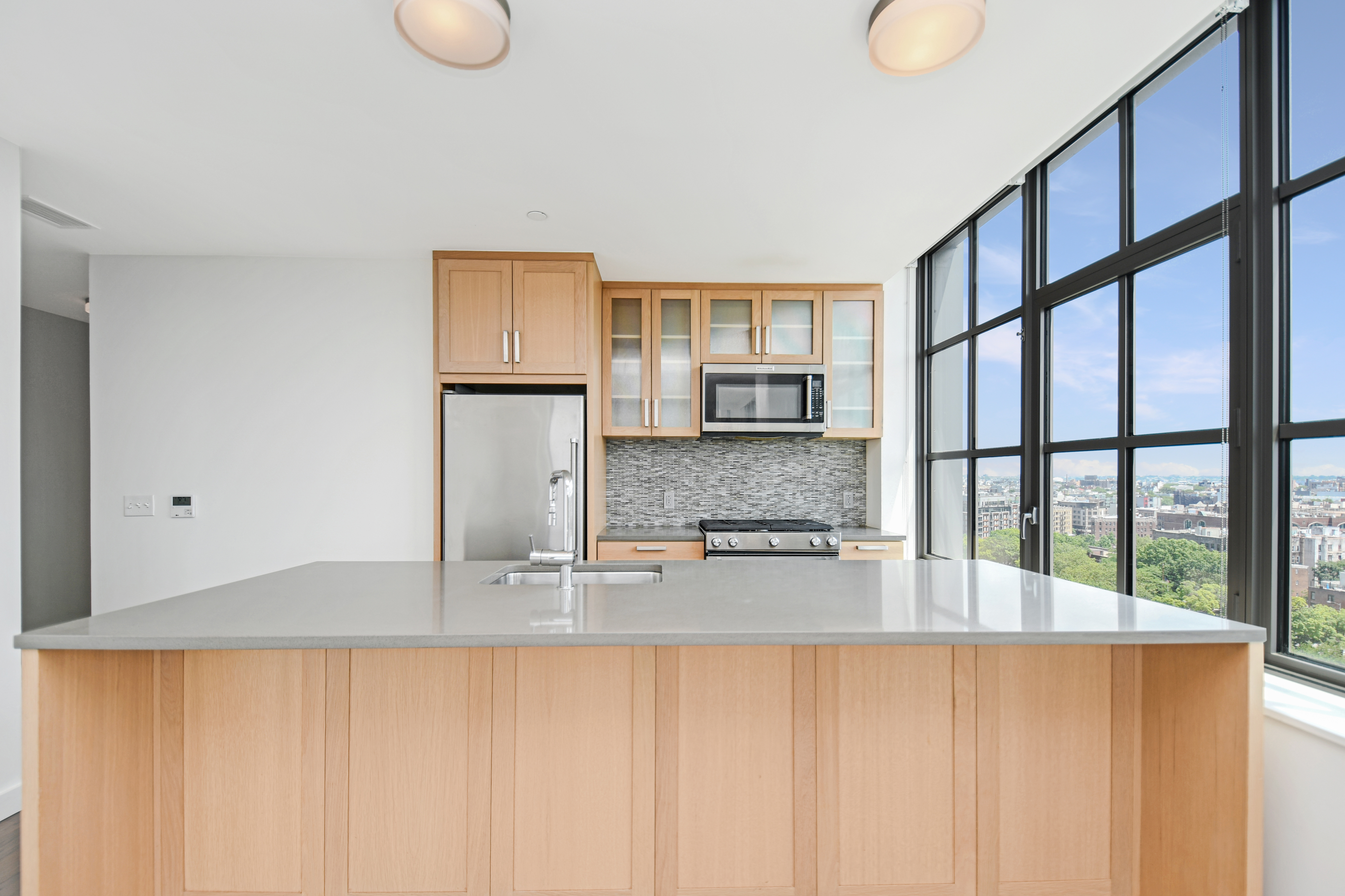 a kitchen with stainless steel appliances granite countertop a sink and a granite counter tops