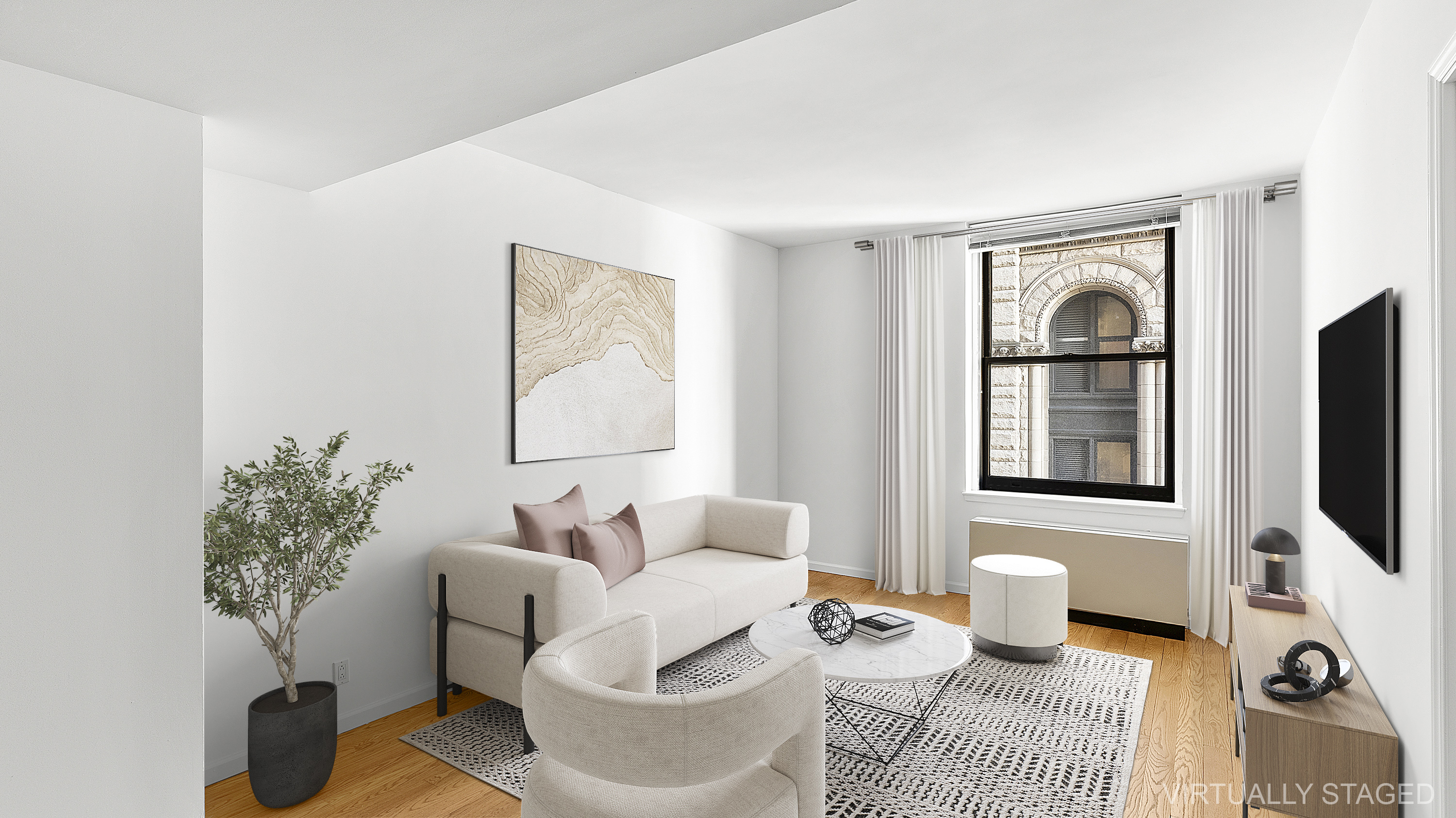 a living room with furniture and a flat screen tv