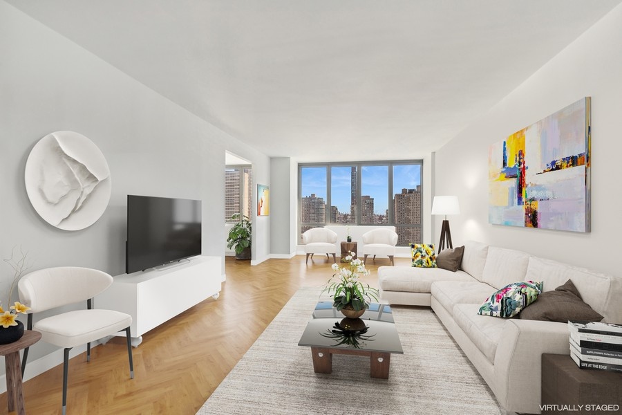 a living room with furniture rug and window