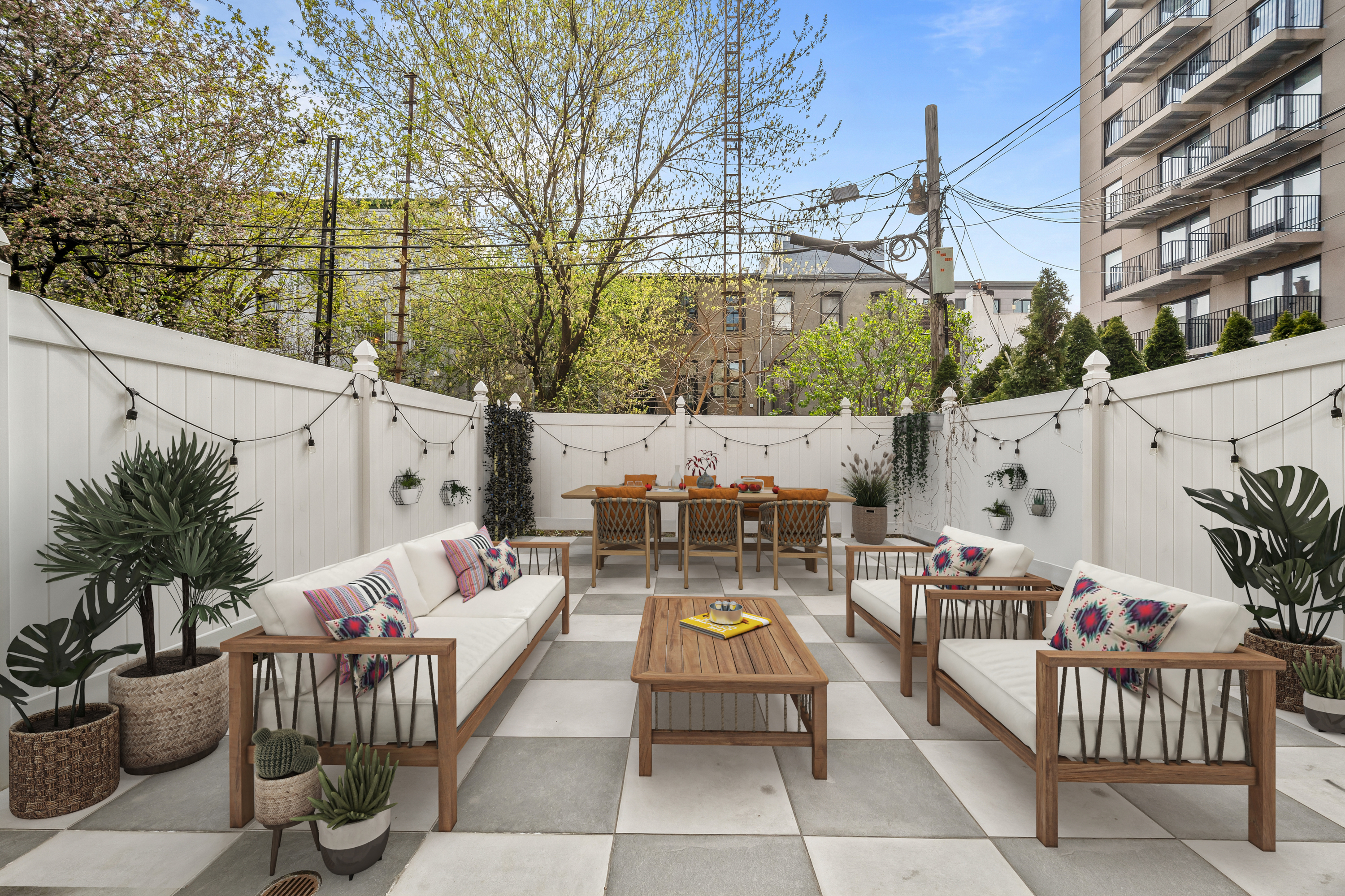 a view of a patio with couches and a fire pit