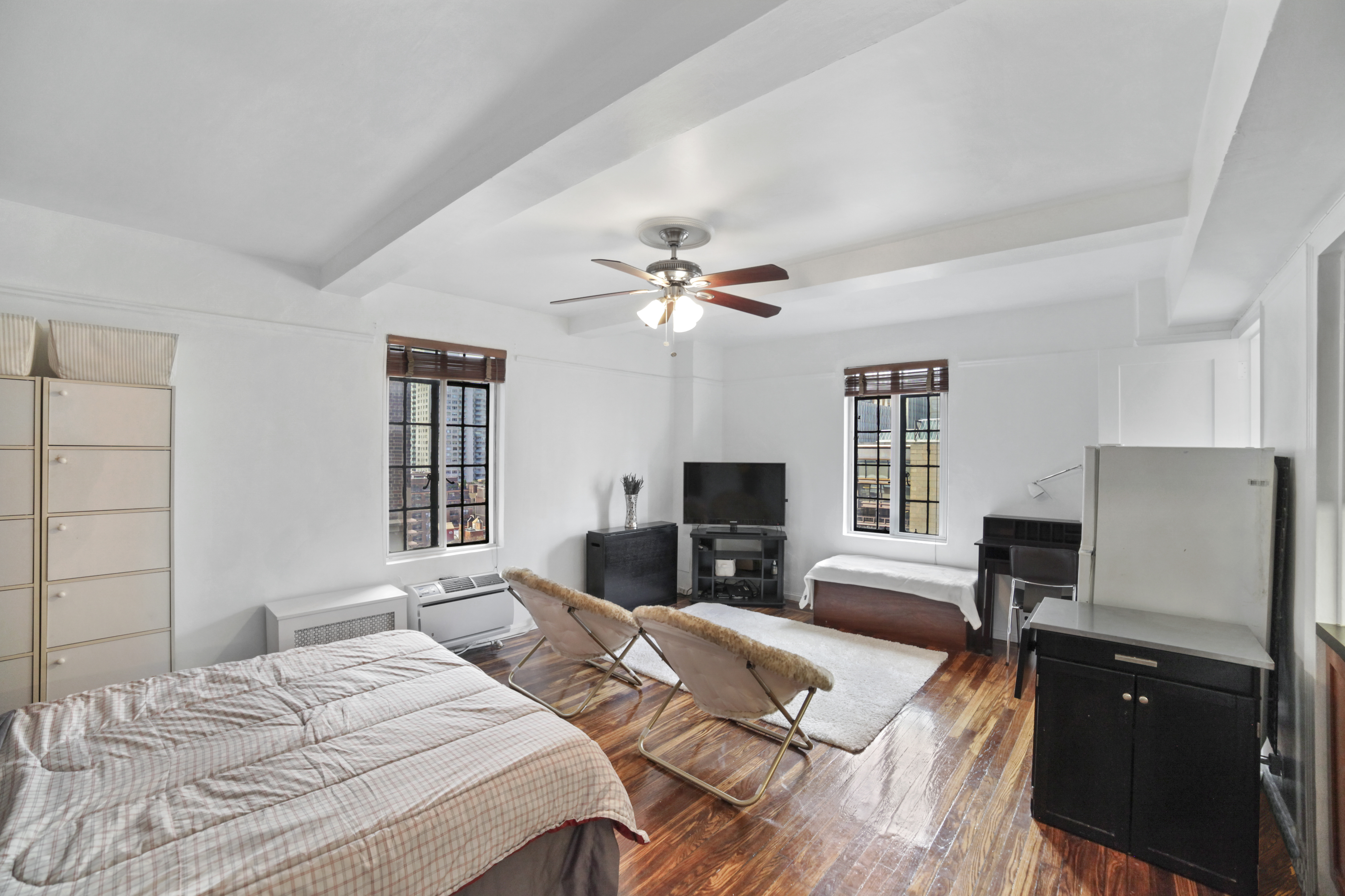 a bedroom with a bed furniture and a fireplace