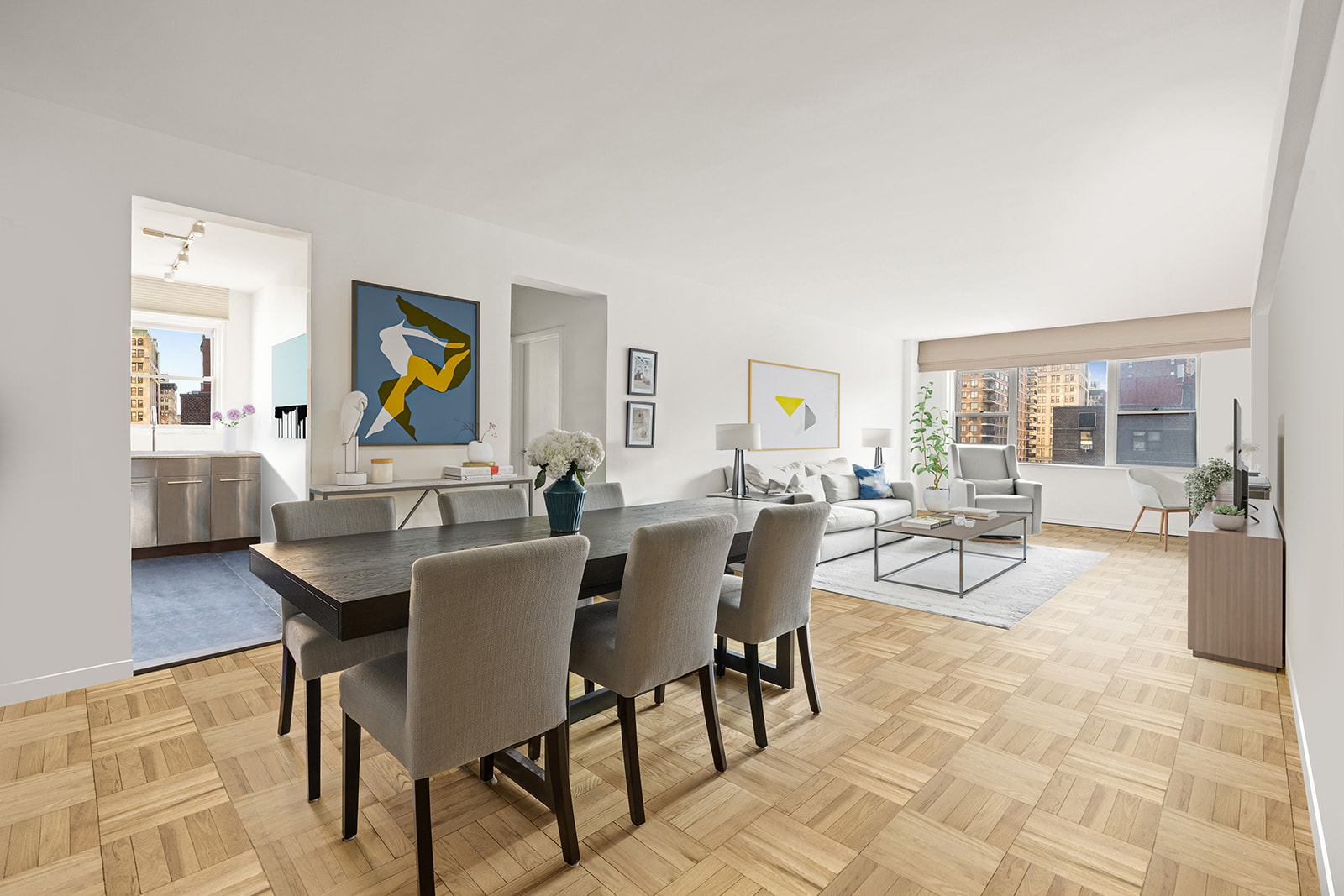 a view of a dining room with furniture and a potted plant