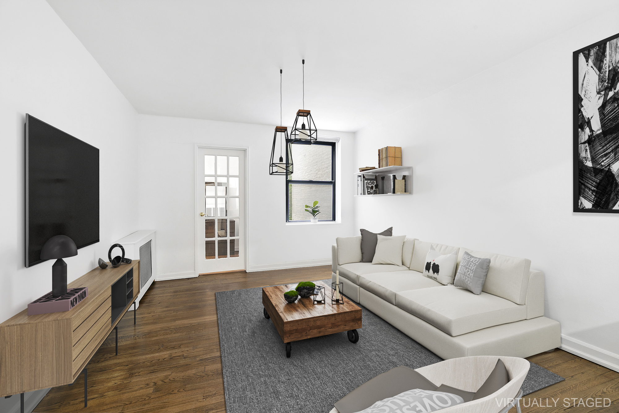 a living room with furniture and a flat screen tv