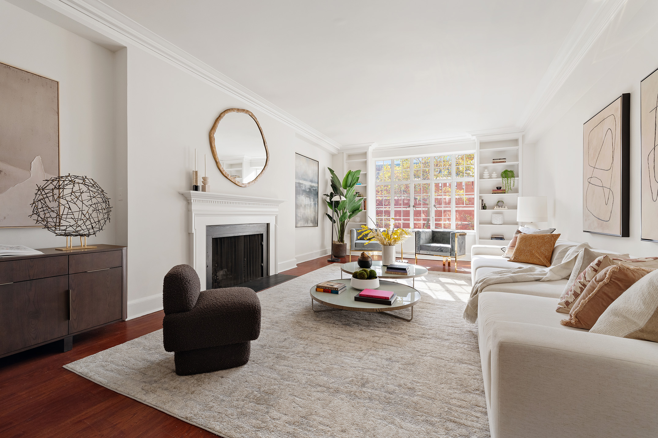 a living room with furniture a window and a fireplace