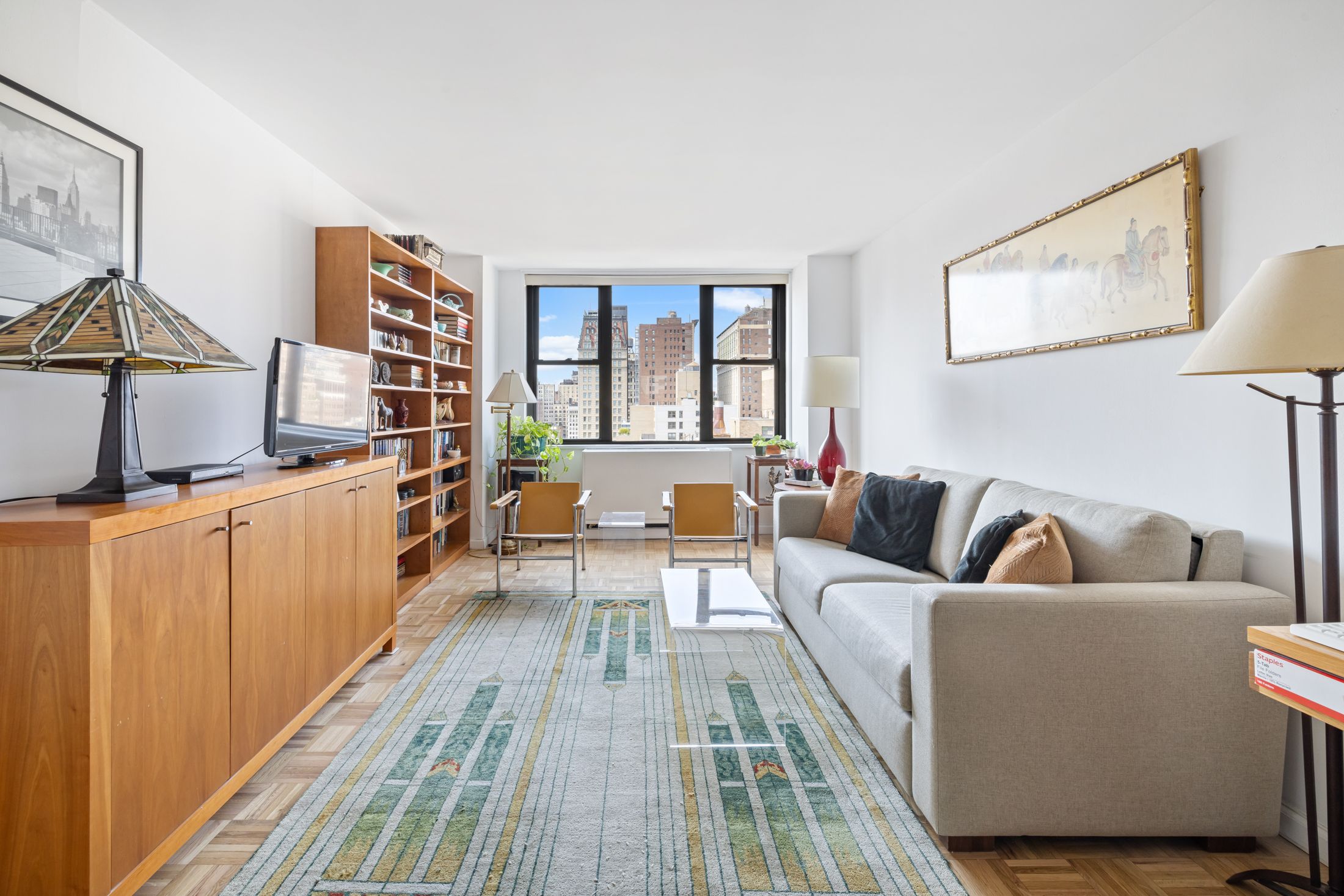 a living room with furniture and a window