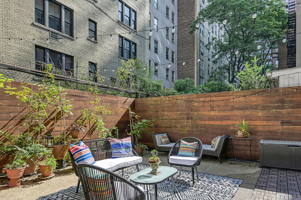 a view of a chairs and table in the patio