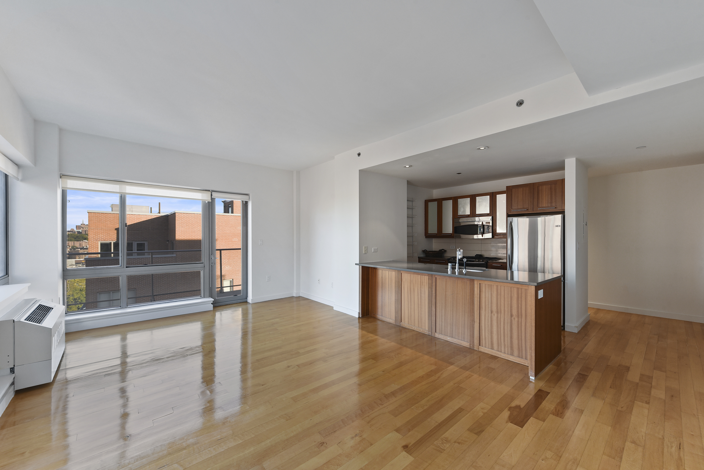 a kitchen with stainless steel appliances granite countertop a refrigerator and stove top oven