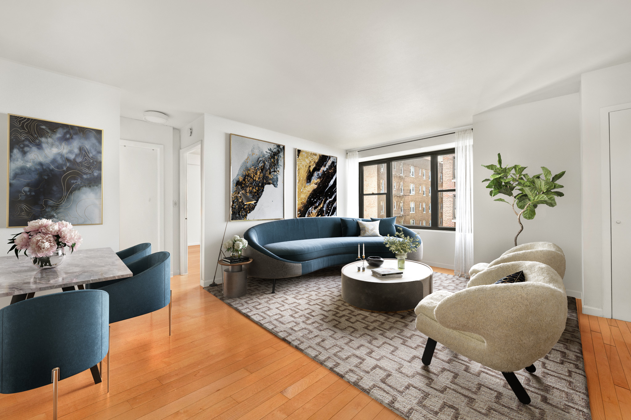 a living room with furniture and a potted plant