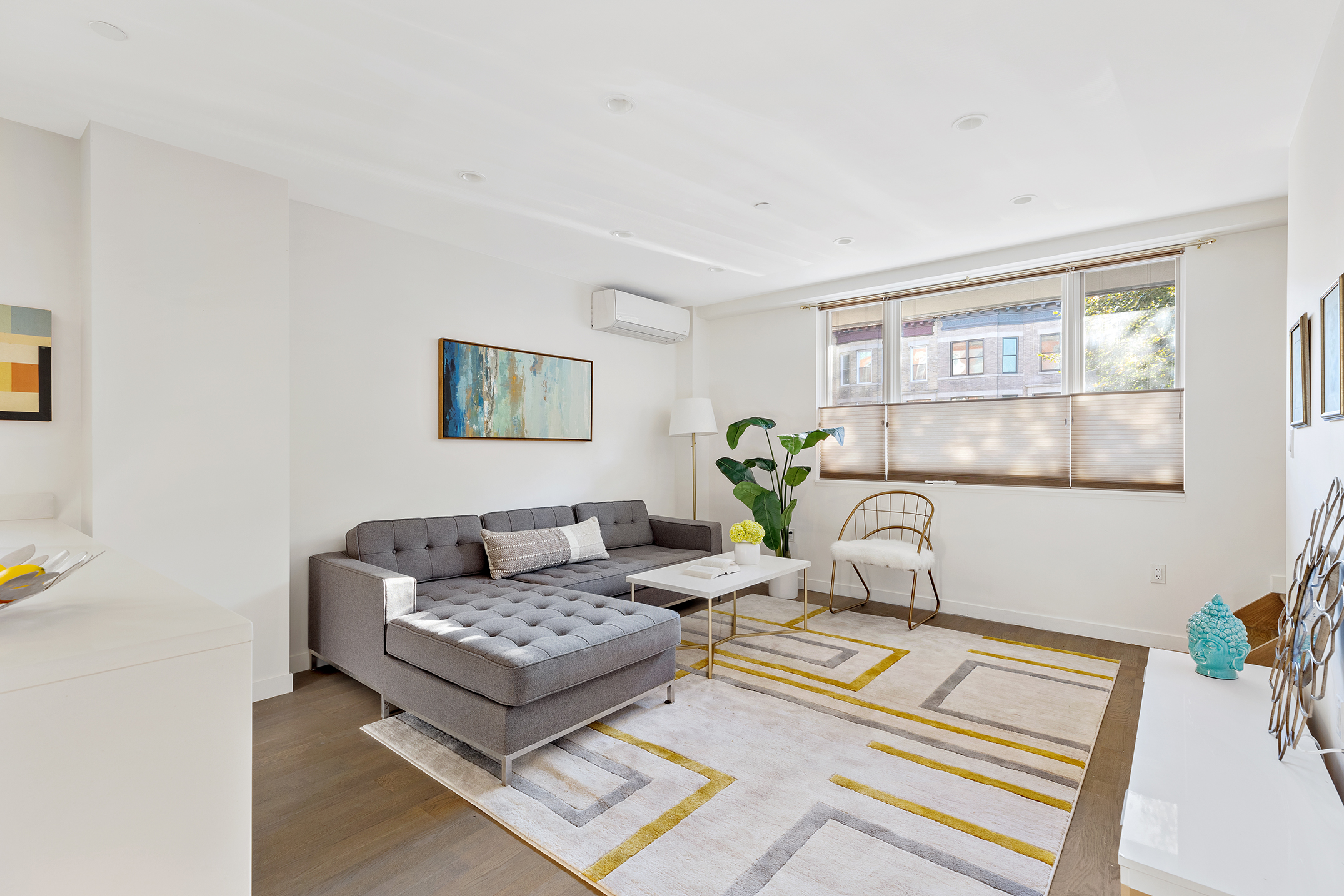 a living room with furniture and a window