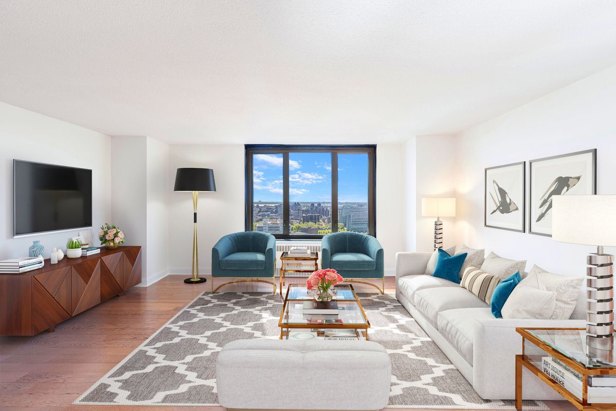 a living room with furniture and a flat screen tv