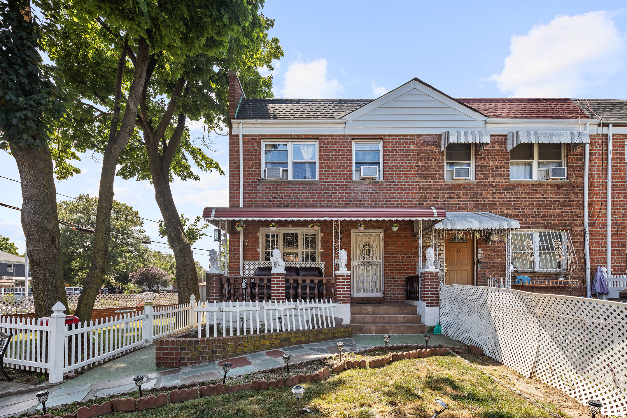 front view of a house with a yard