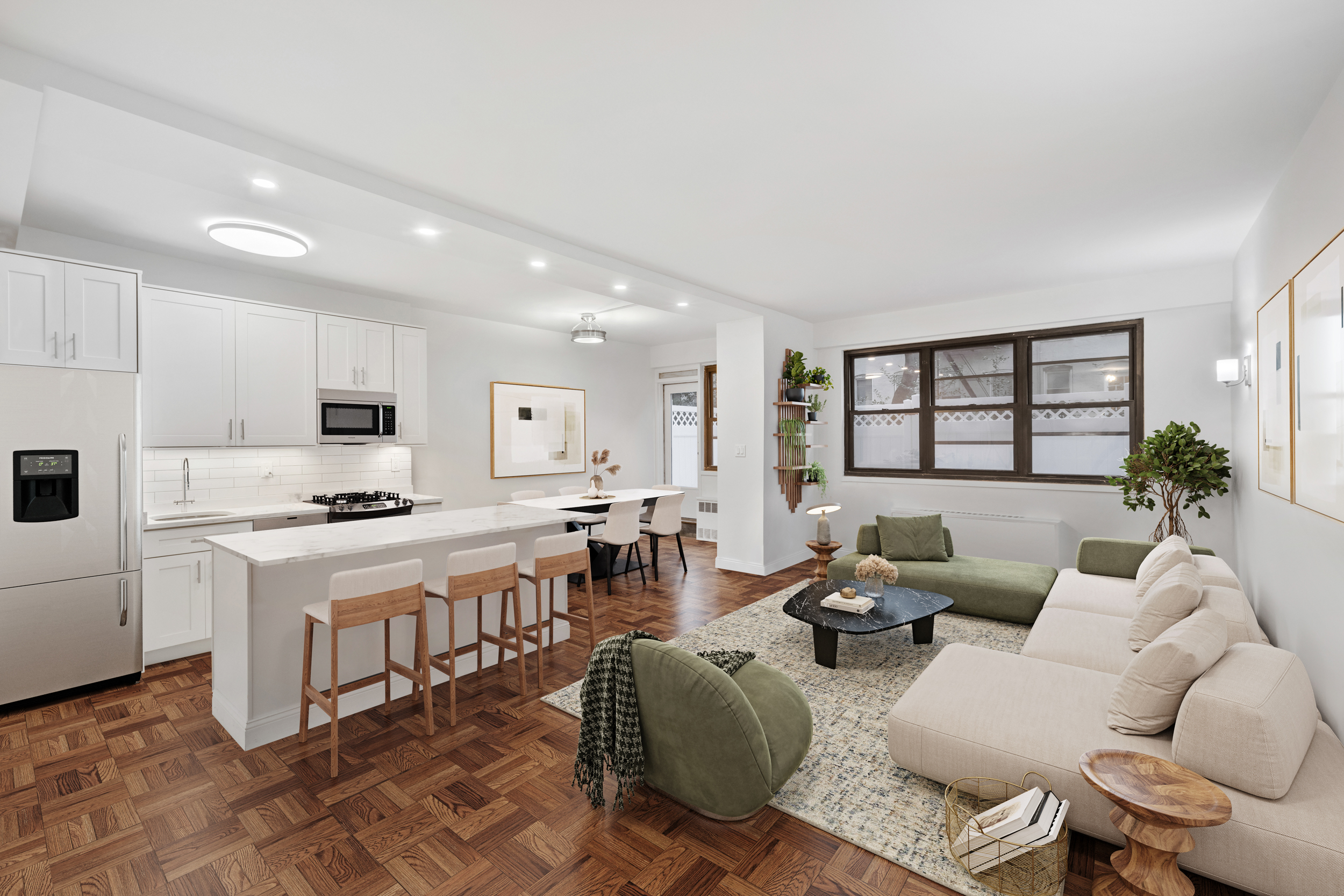 a living room with furniture a rug kitchen view and a window