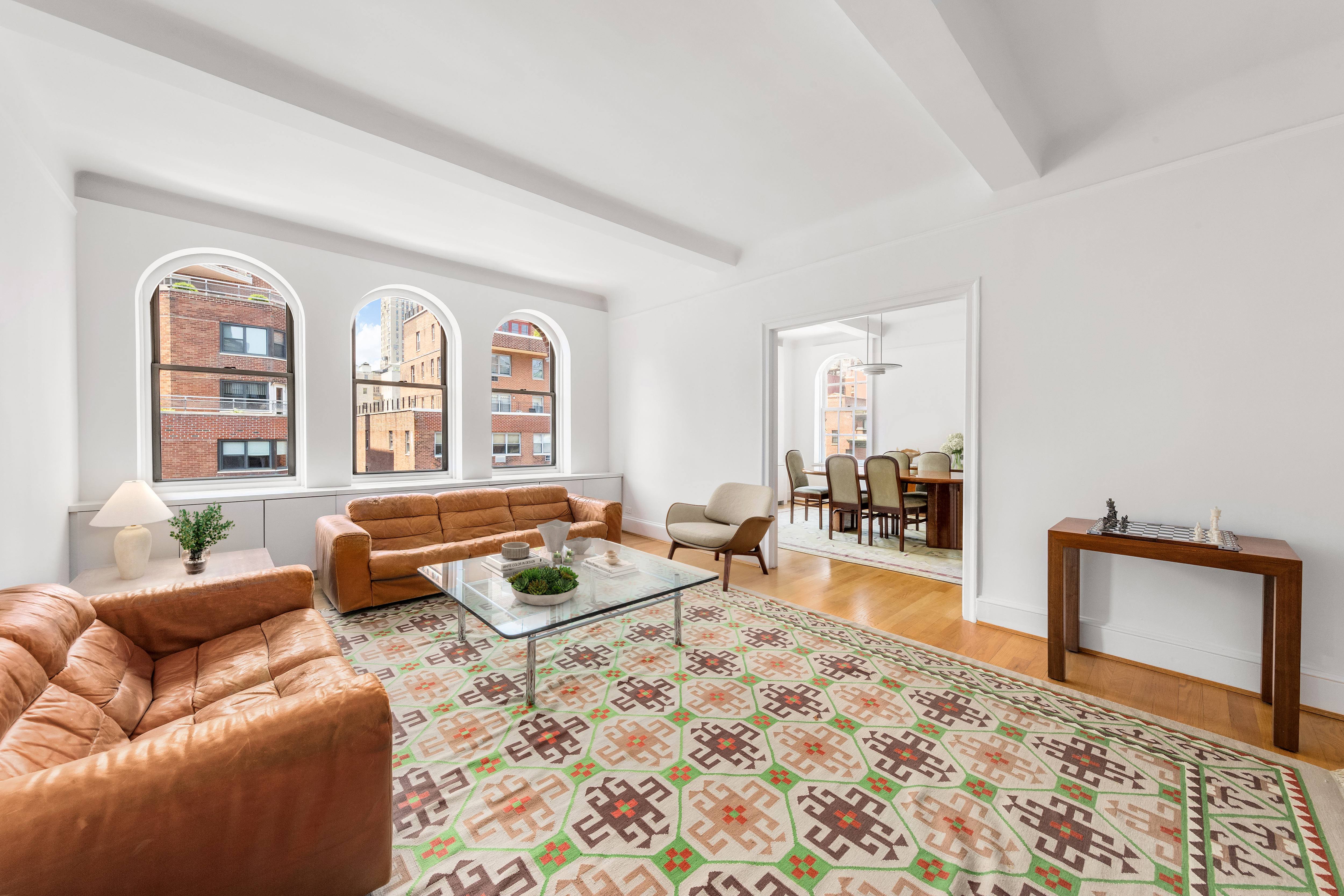 a living room with furniture and a rug