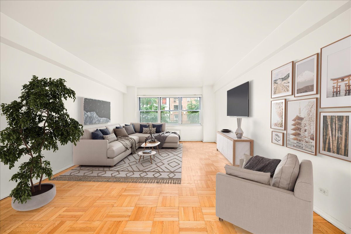 a living room with furniture or couch and a potted plant