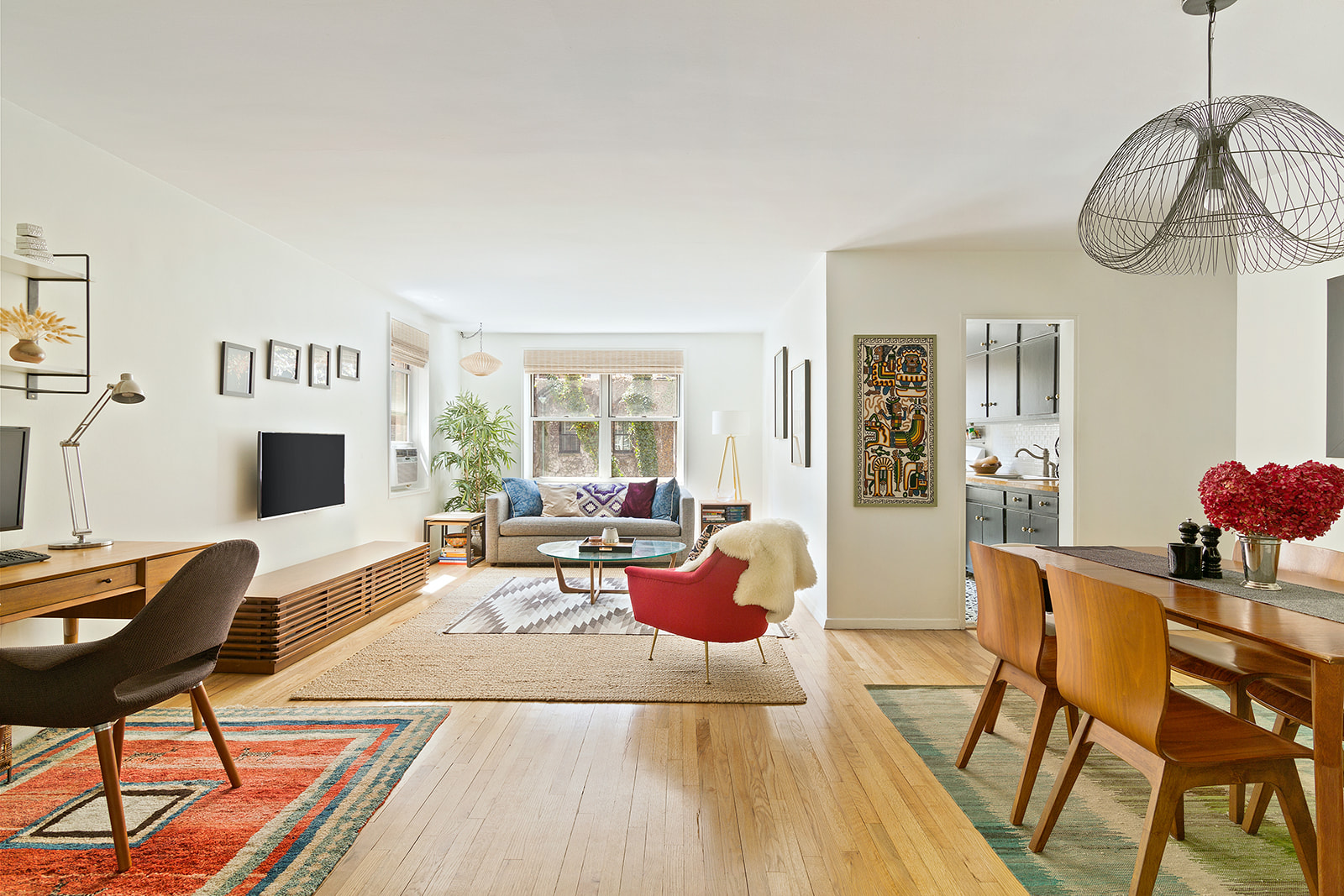 a living room with furniture a fireplace and a table