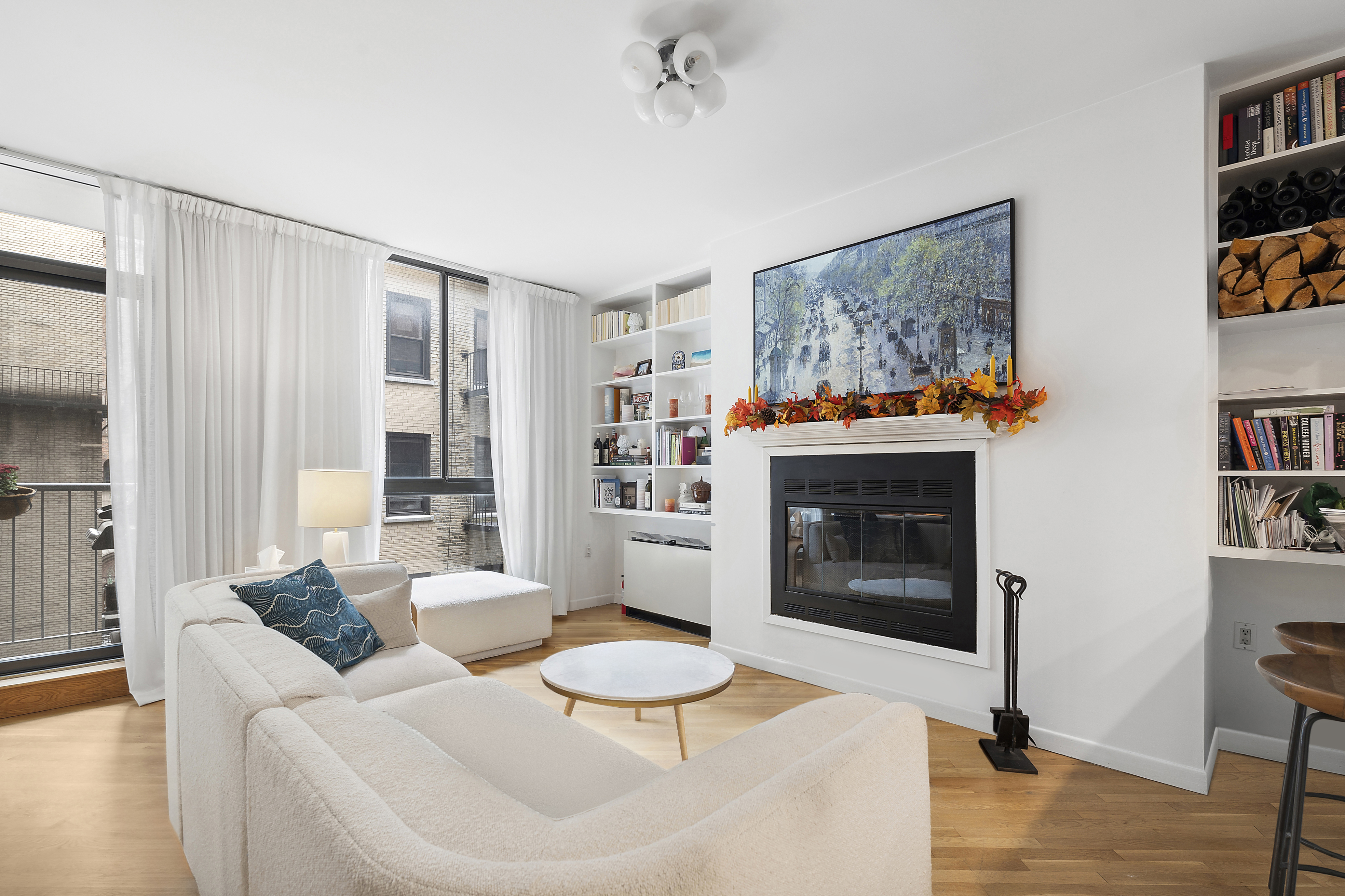 a living room with furniture and a fireplace