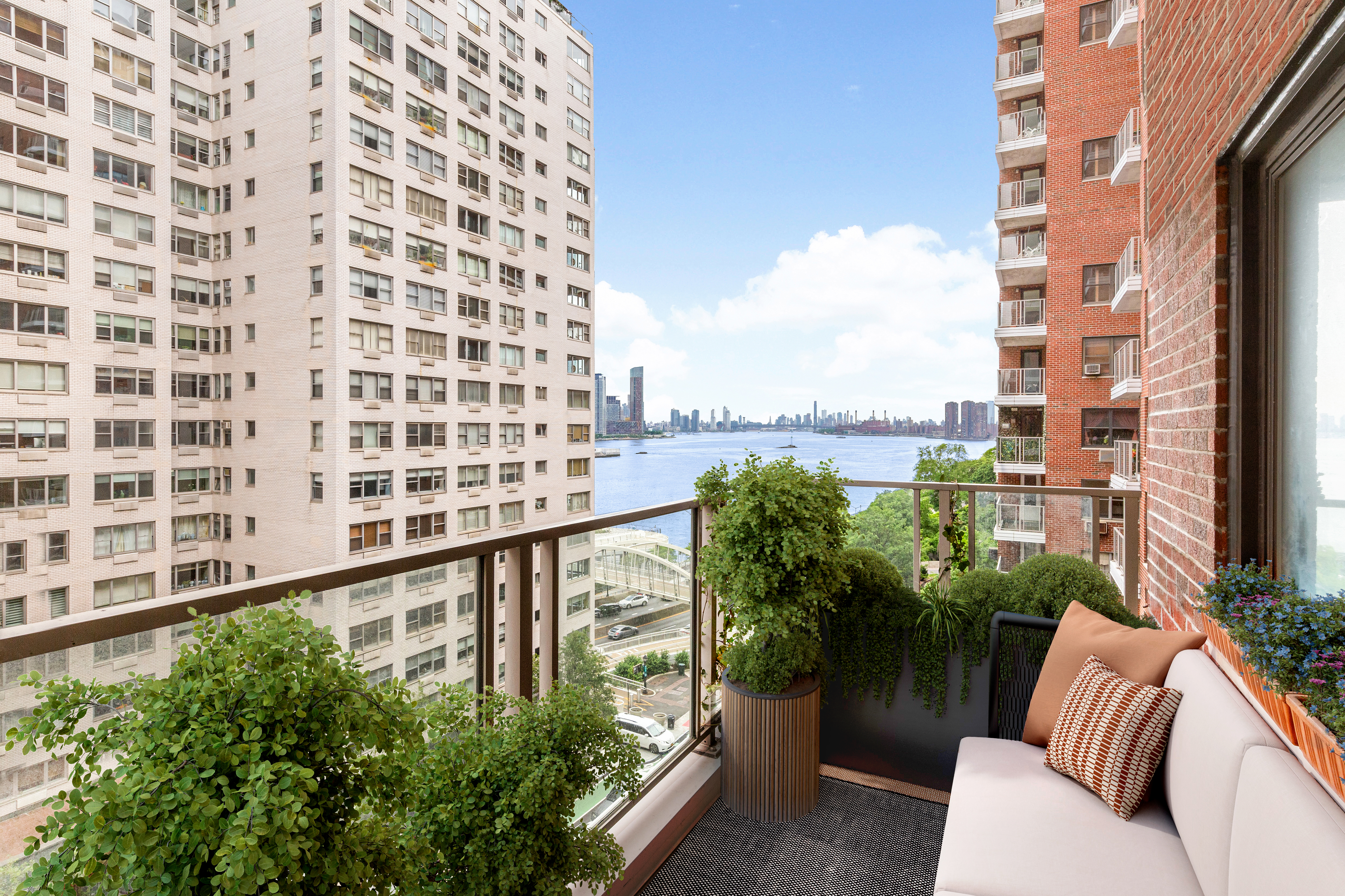 a view of a balcony with couches and wooden floor