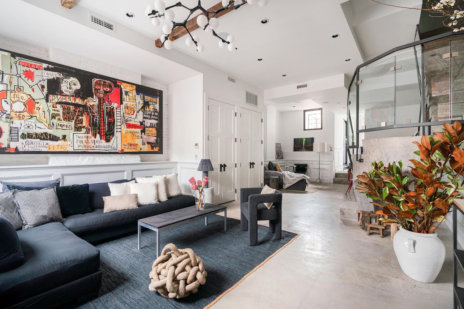 a living room with furniture and flowers