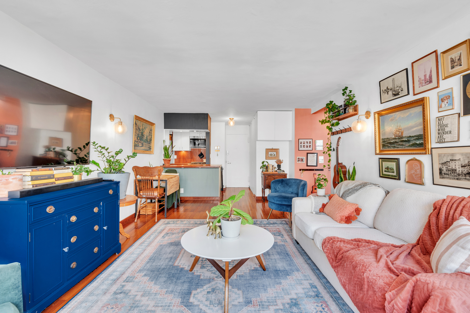 a living room with furniture and a flat screen tv