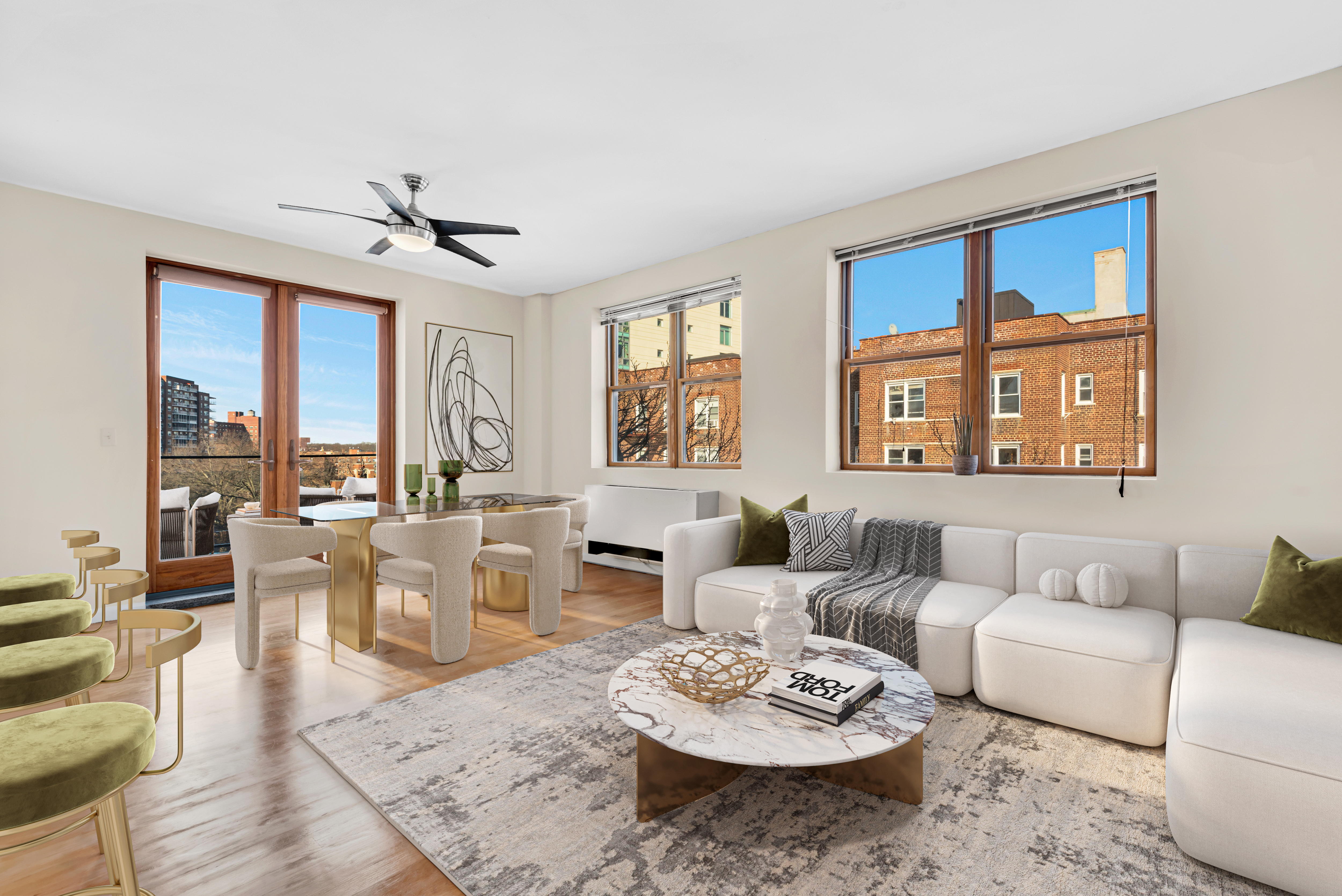 a living room with furniture kitchen view and a large window