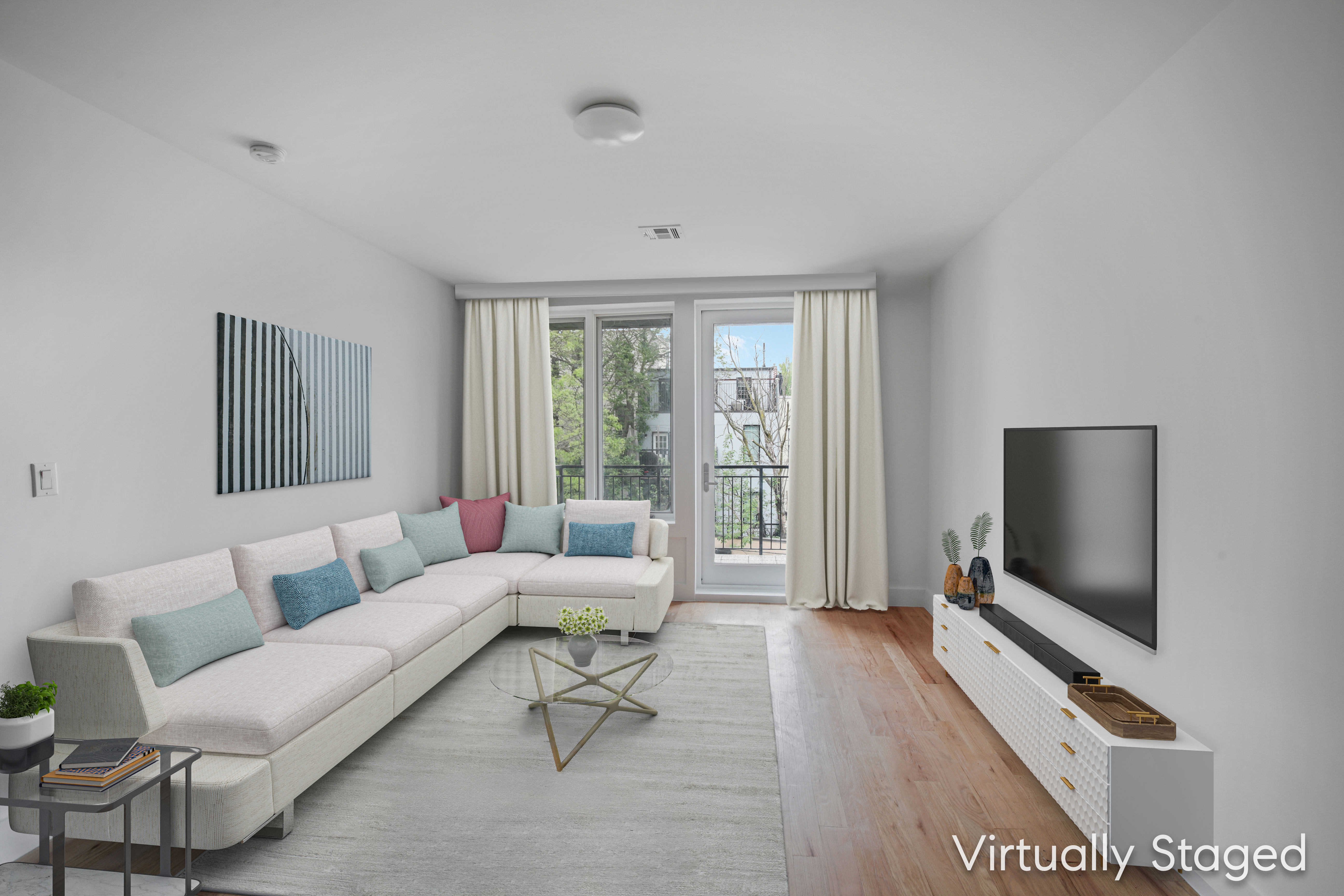 a living room with furniture and a flat screen tv