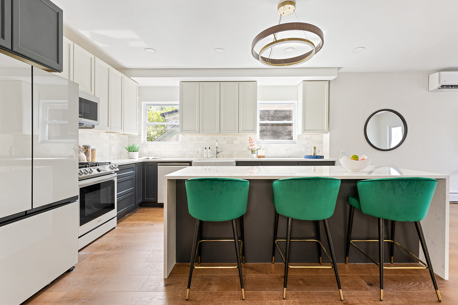 a kitchen with stainless steel appliances granite countertop a stove a sink and a refrigerator