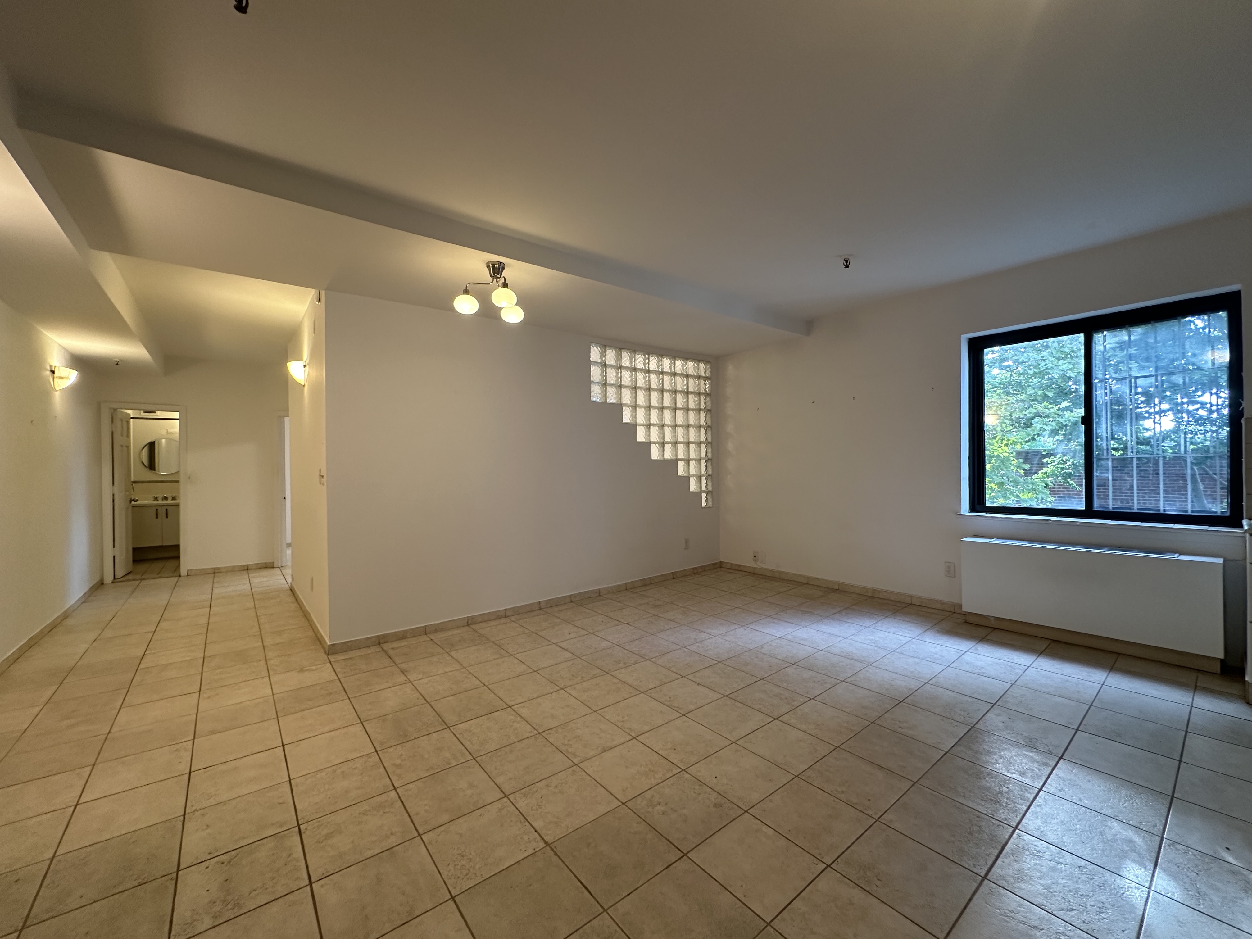 a view of an empty room and window