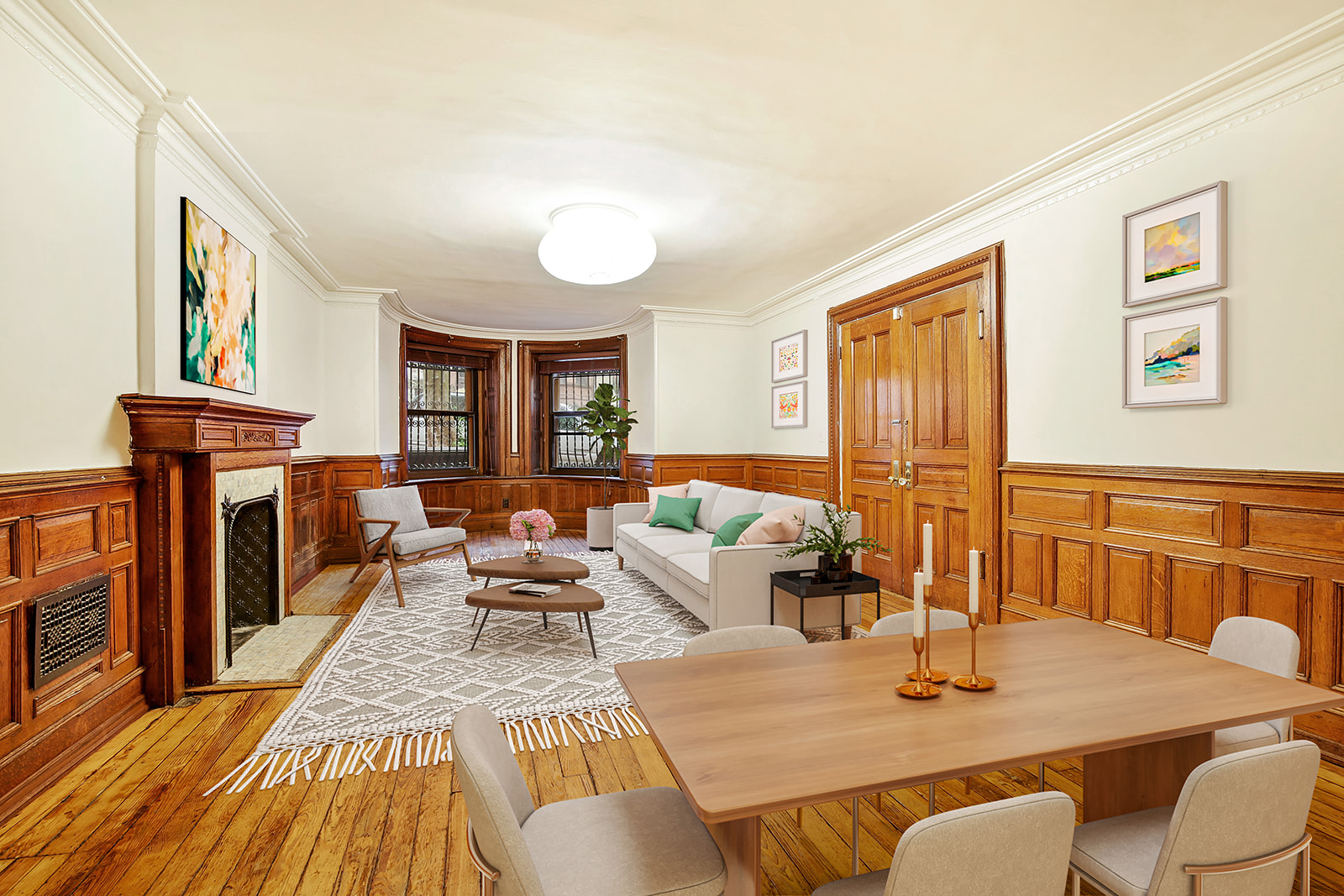 a living room with fireplace furniture and a wooden floor