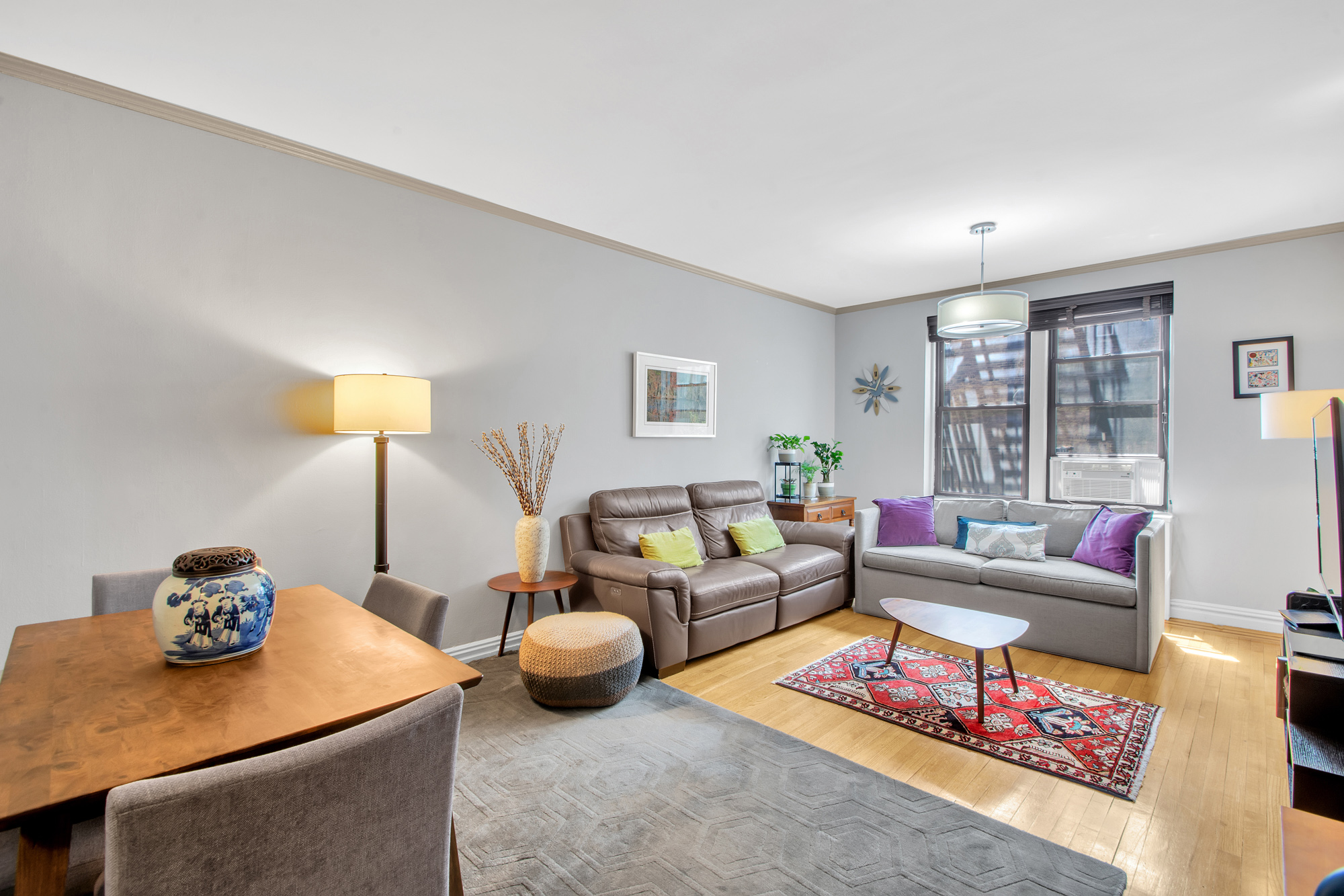 a living room with furniture and a table