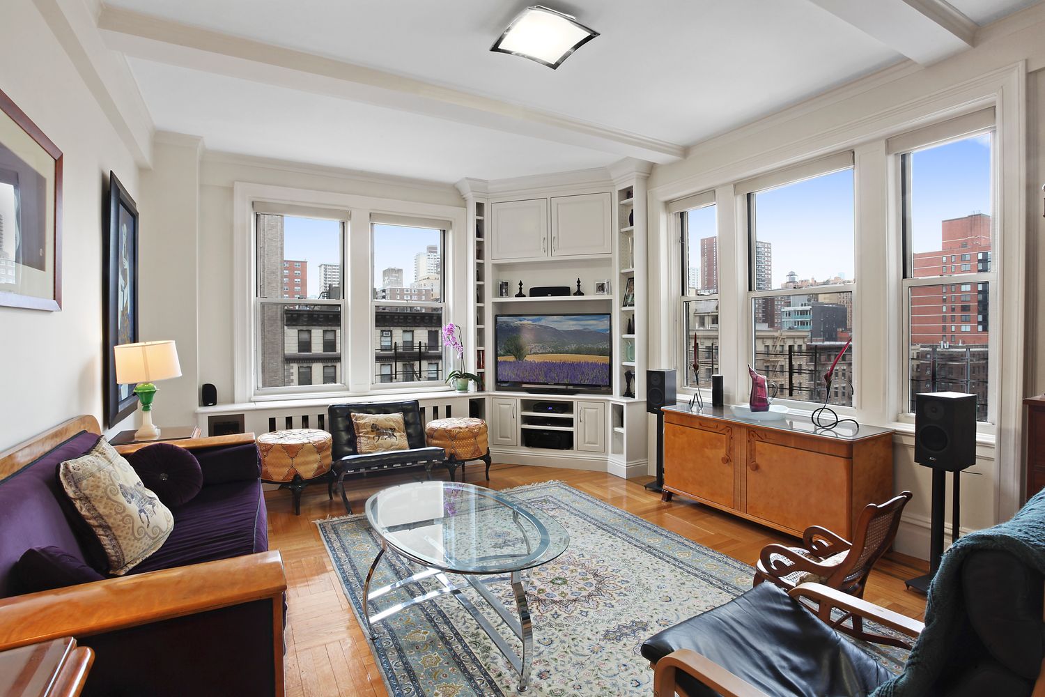 a living room with furniture fireplace and flat screen tv