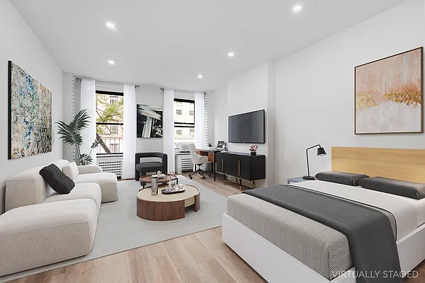 a living room with fireplace furniture and a flat screen tv