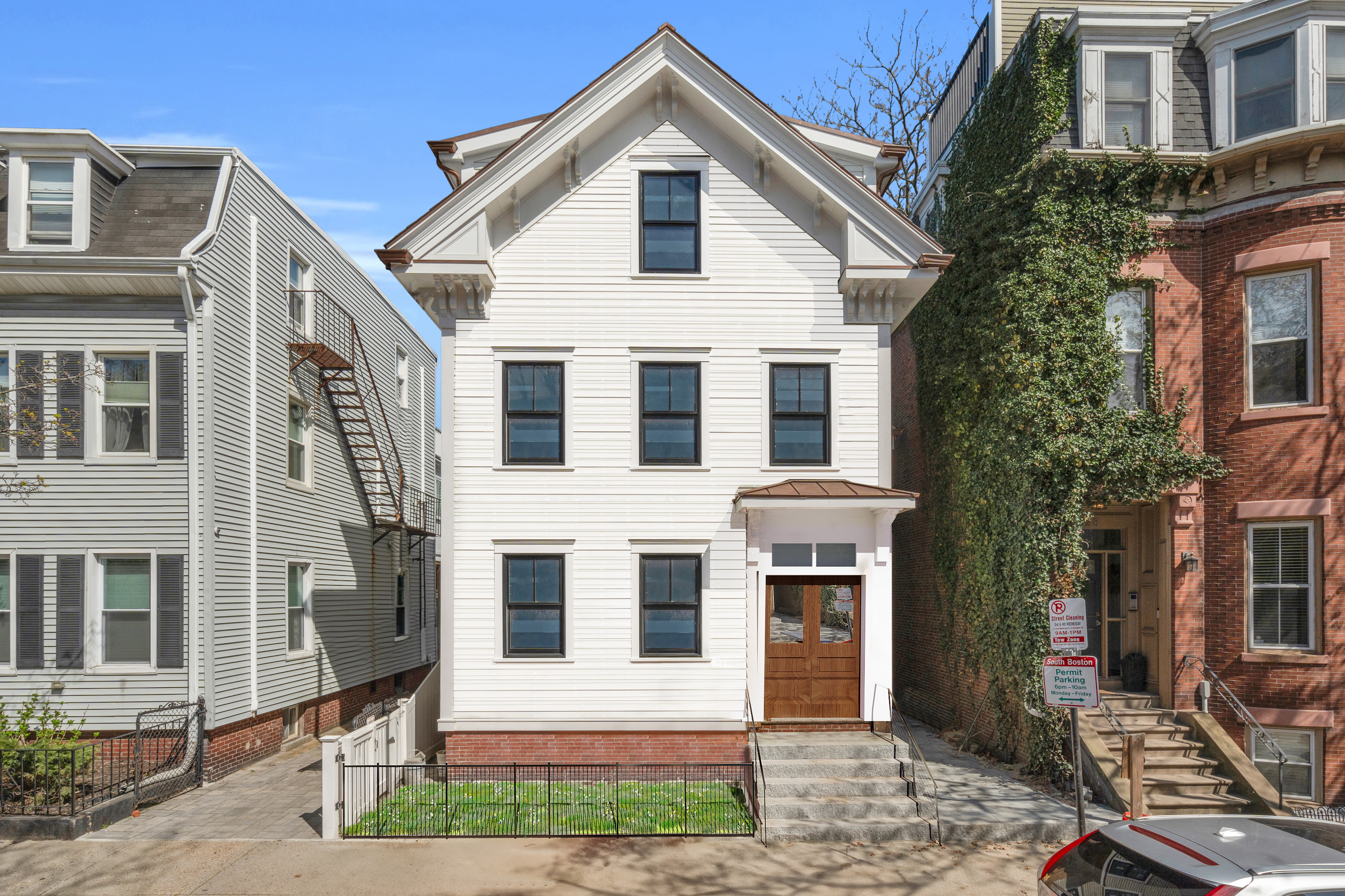 a view of a brick house with many windows