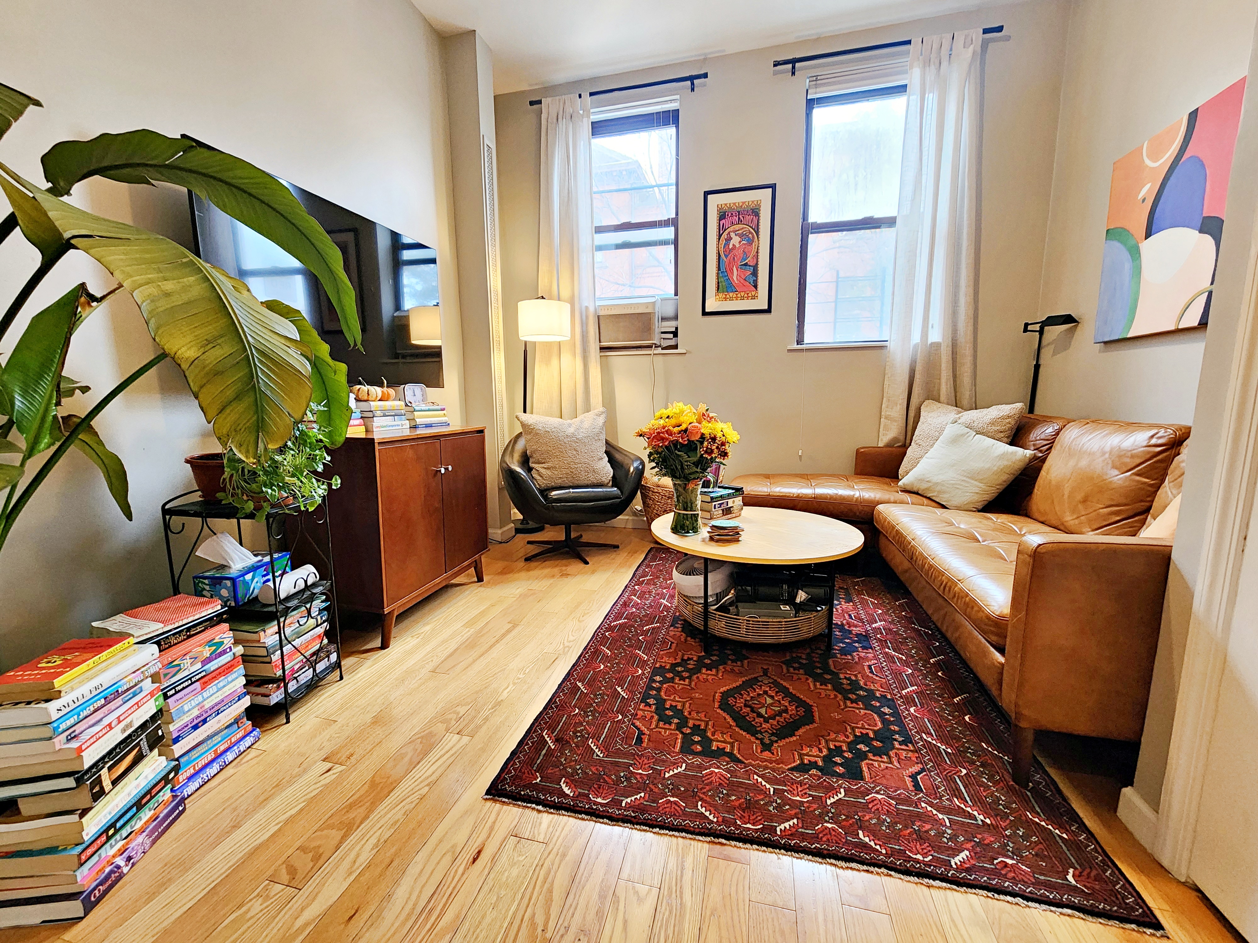 a living room with furniture and a rug