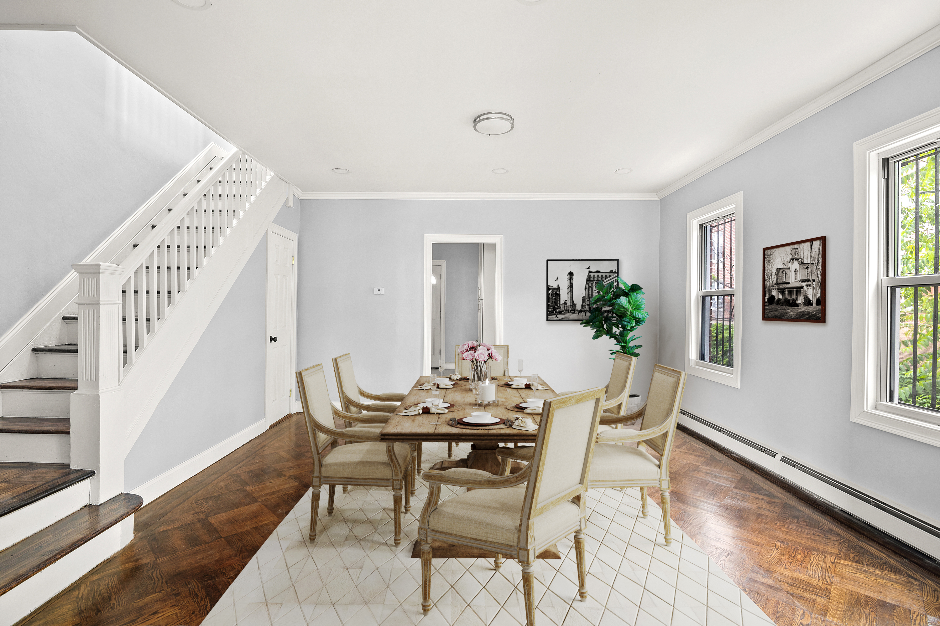 a view of a dining room with furniture and wooden floor