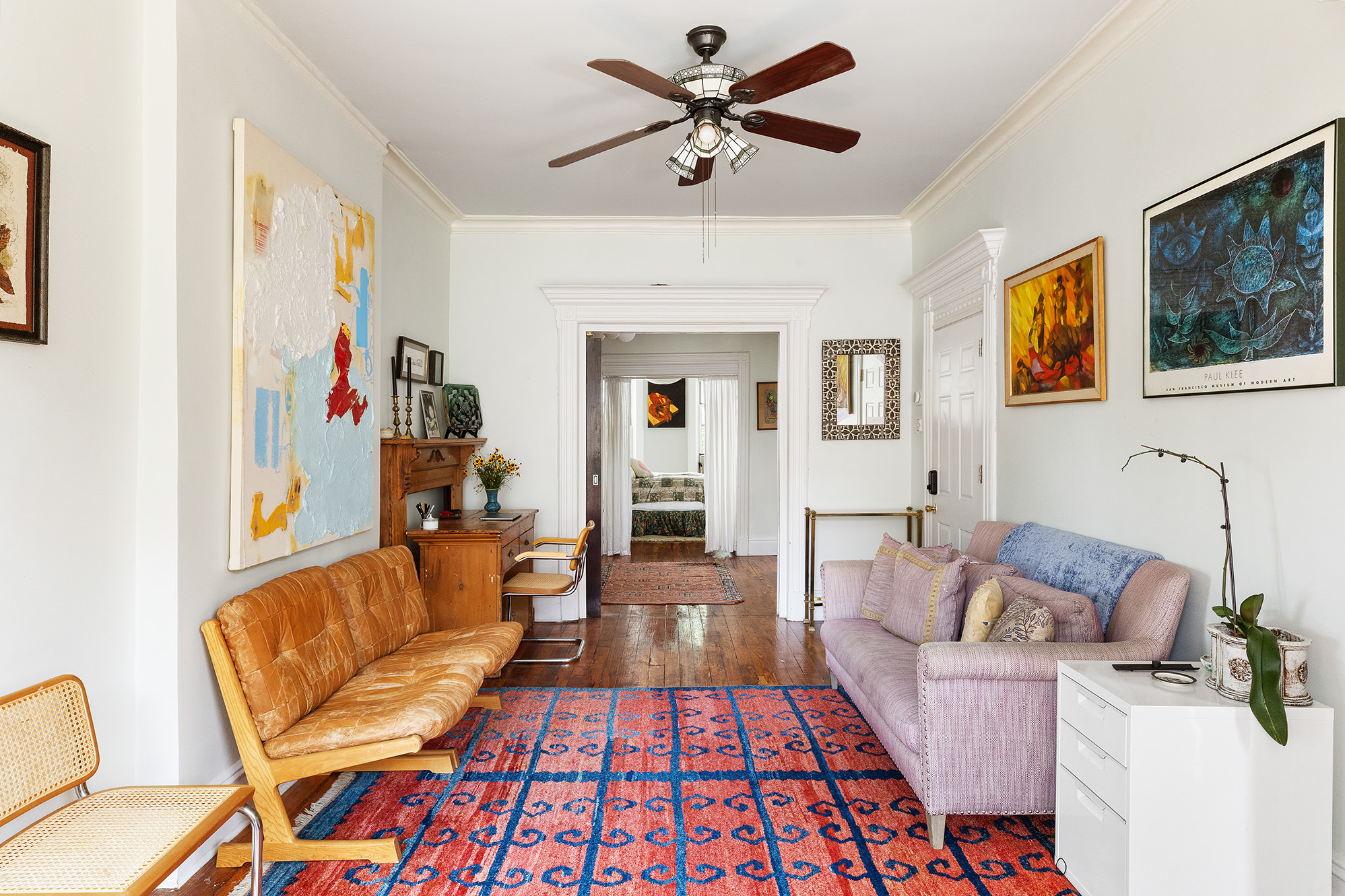 a living room with furniture and a rug