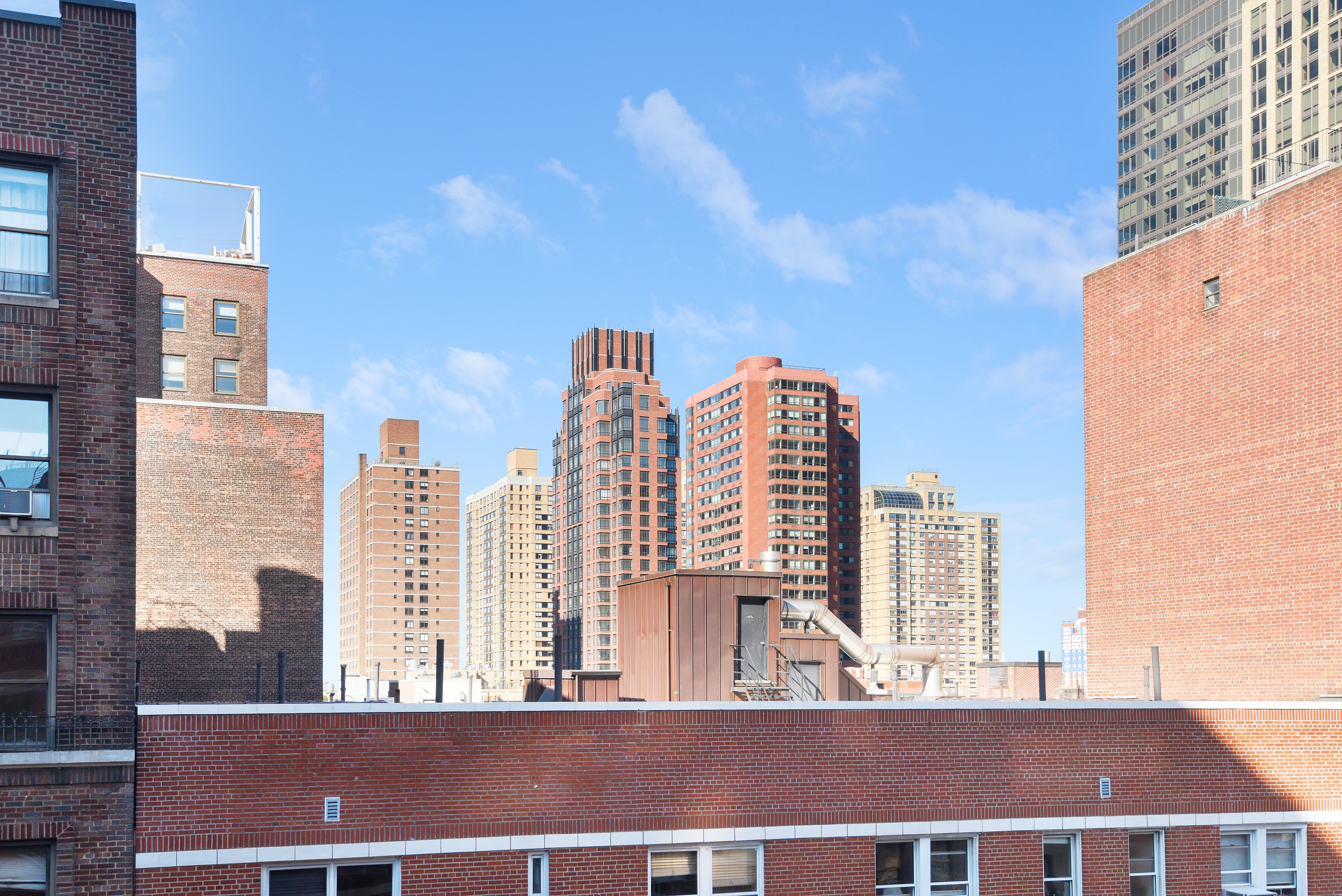 a view of city with tall buildings