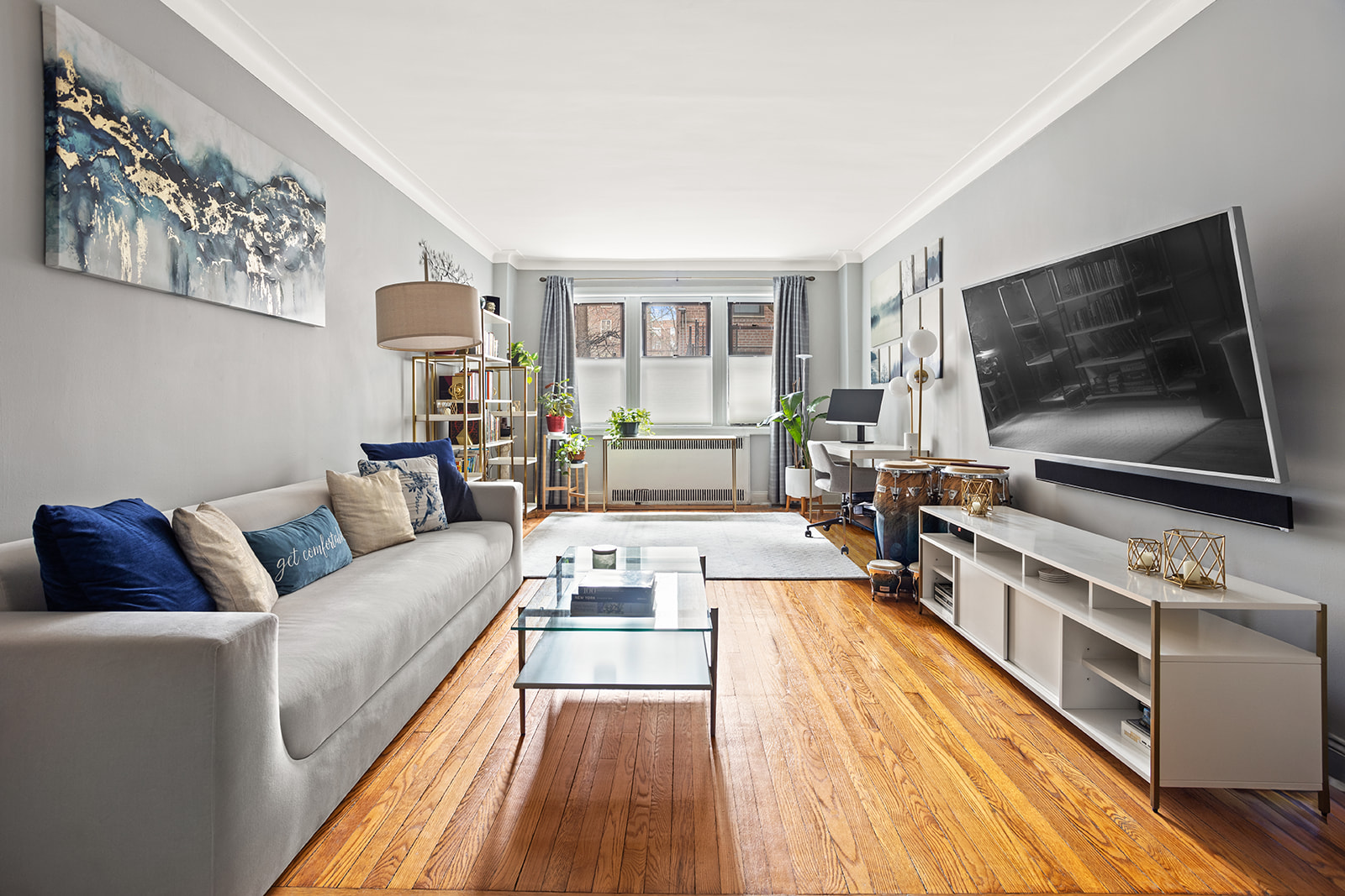 a living room with furniture and a flat screen tv