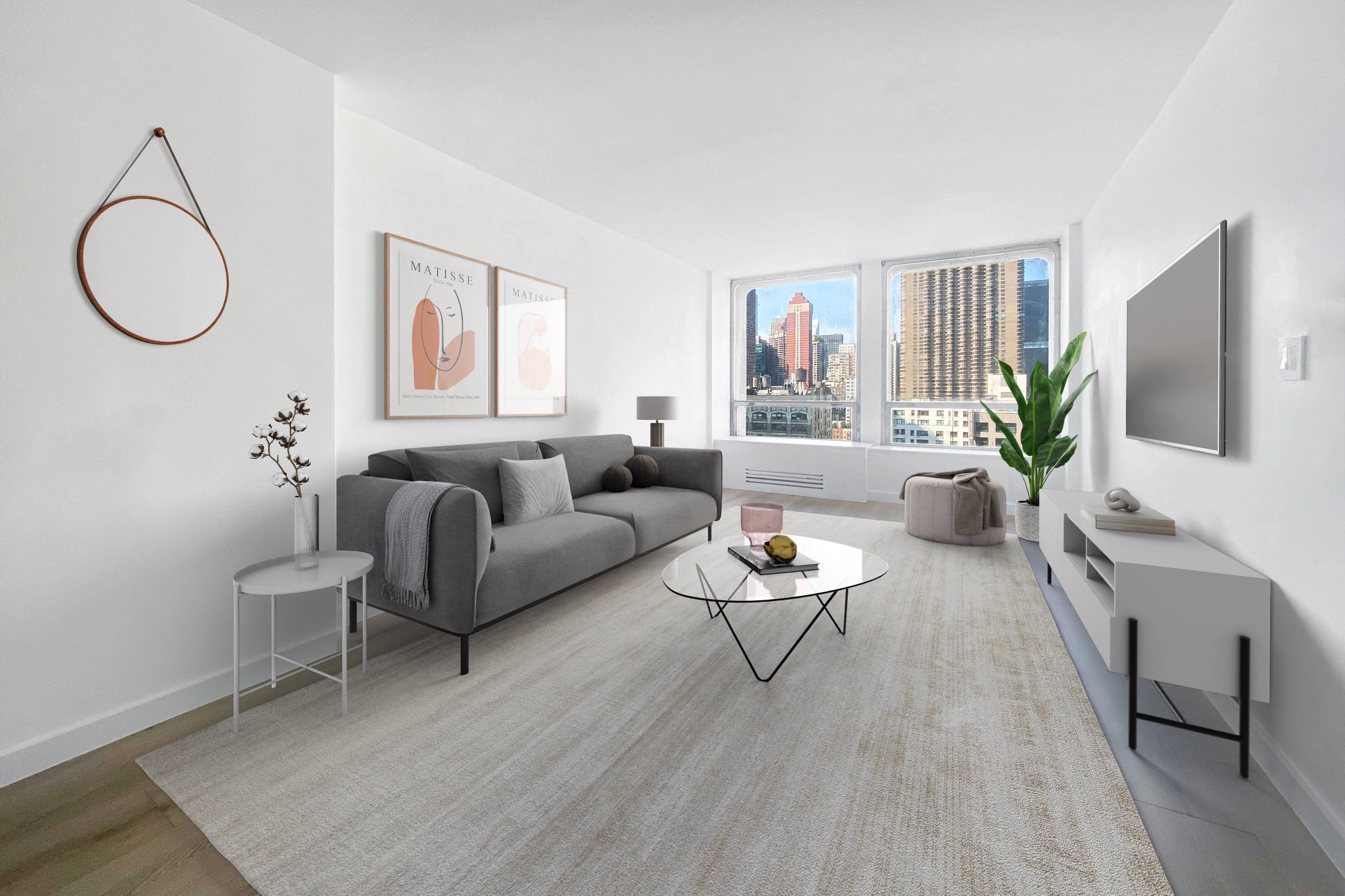 a living room with furniture potted plant and a wooden floor