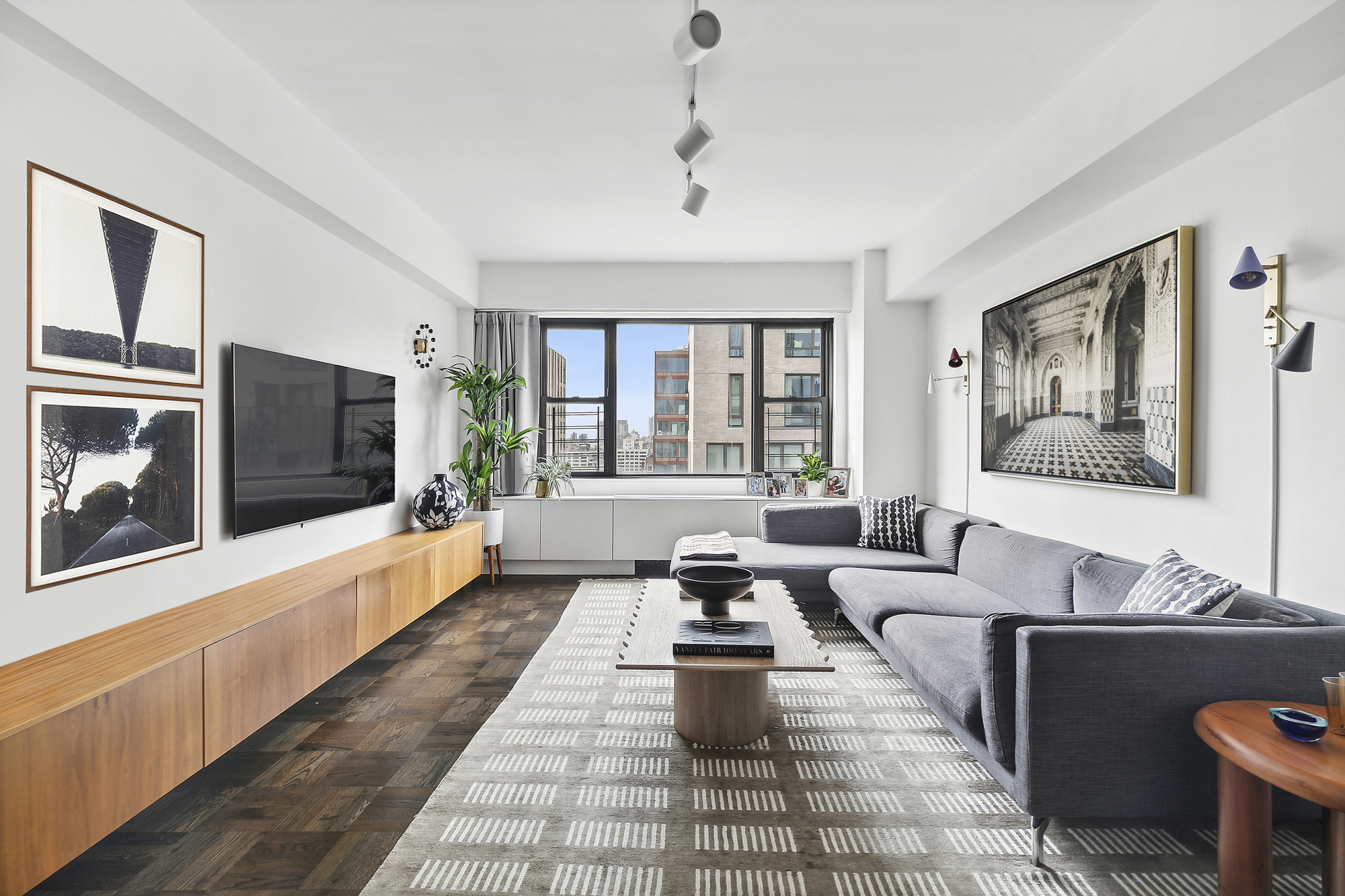 a living room with furniture and a flat screen tv