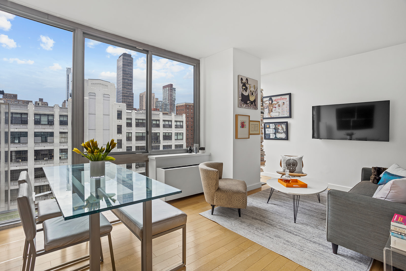 a living room with furniture and a flat screen tv