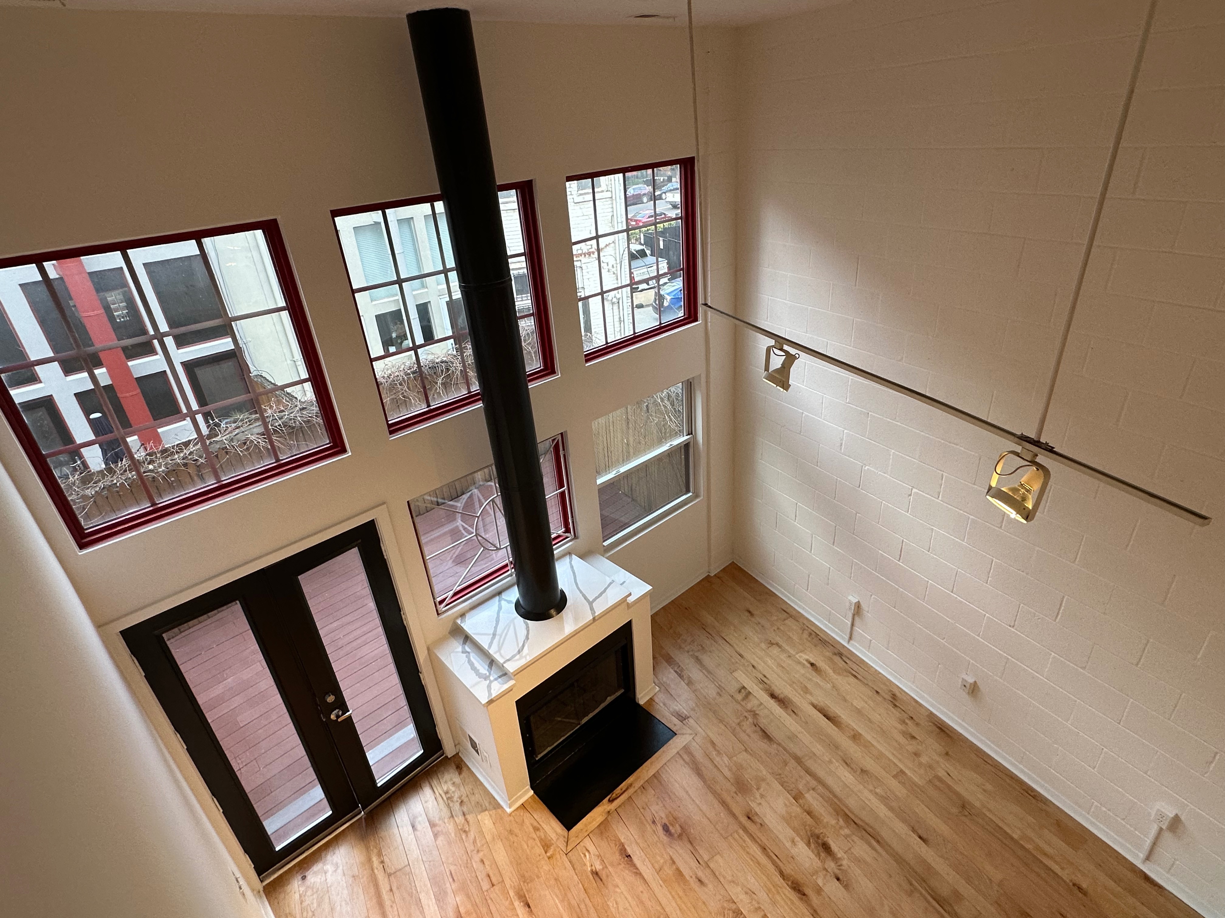 a view of an entryway with wooden floor and door