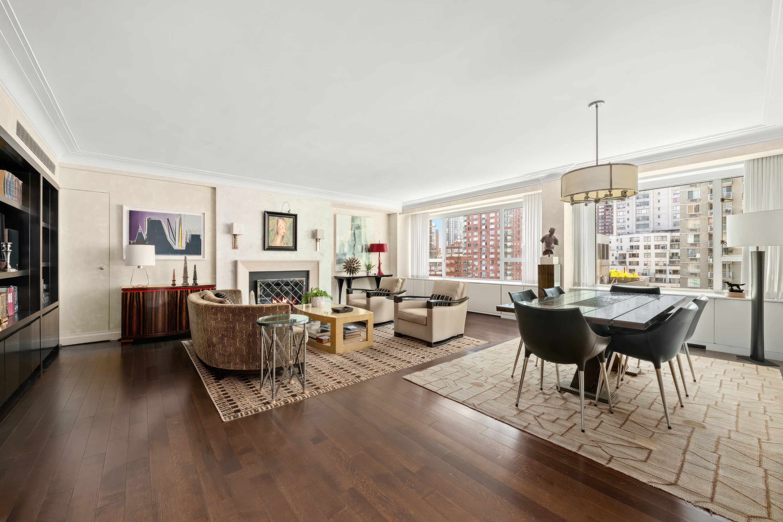 a living room with furniture dining table and a wooden floor