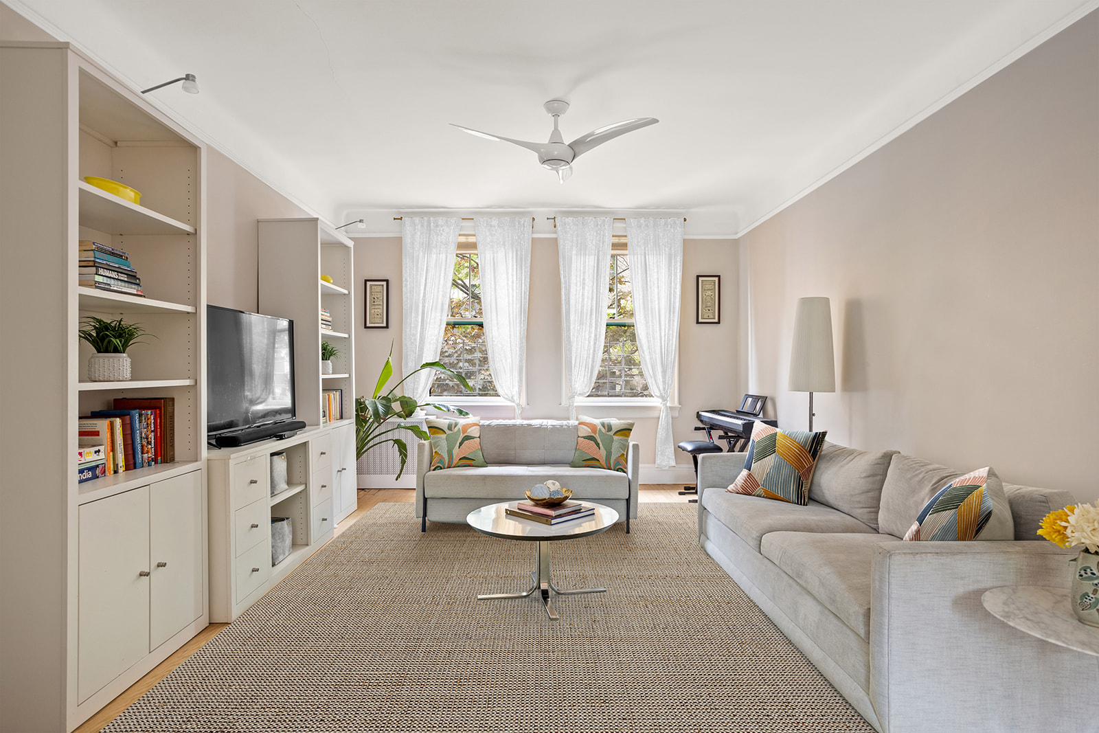 a living room with furniture and a large window