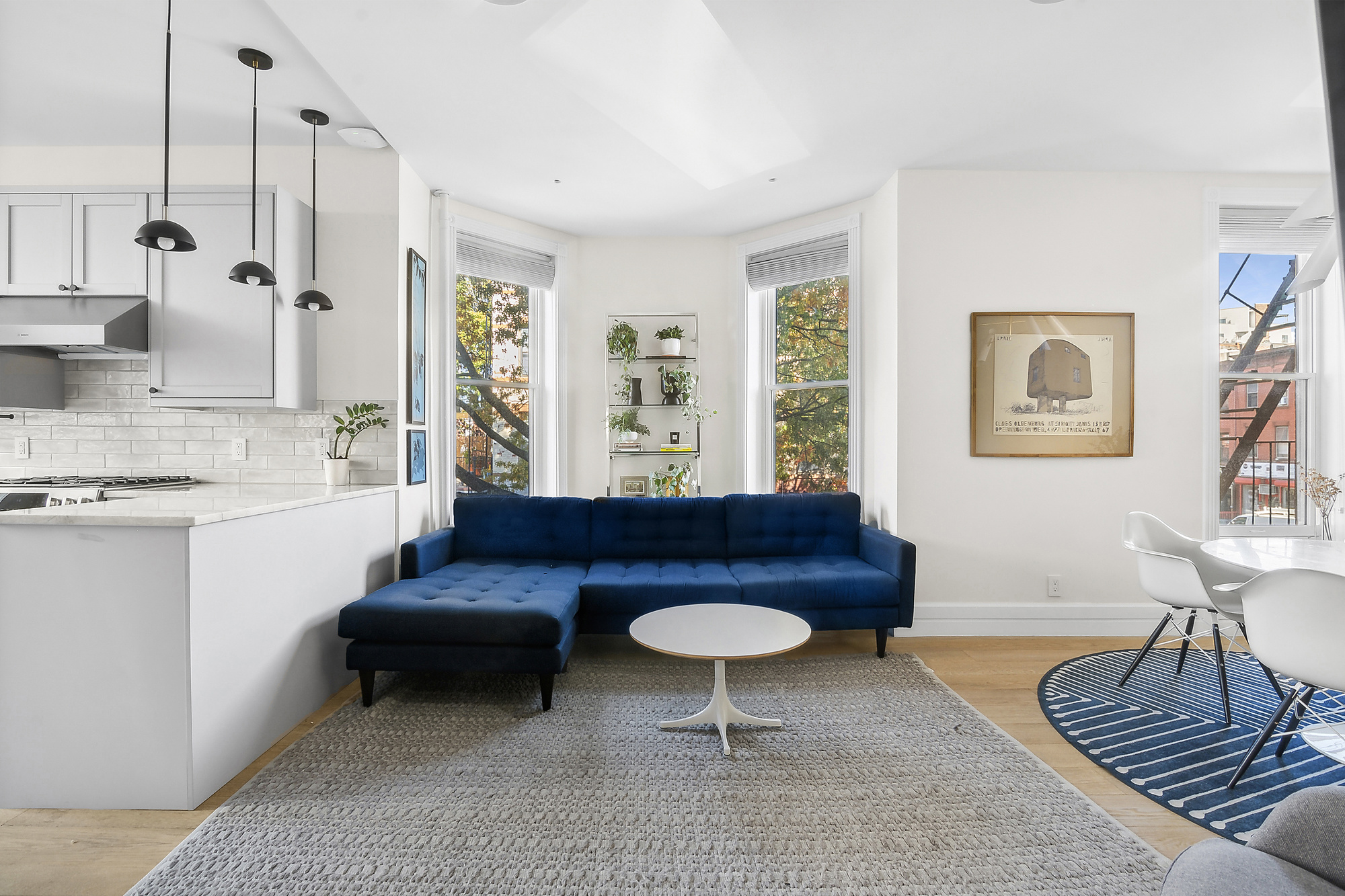 a living room with furniture and a rug