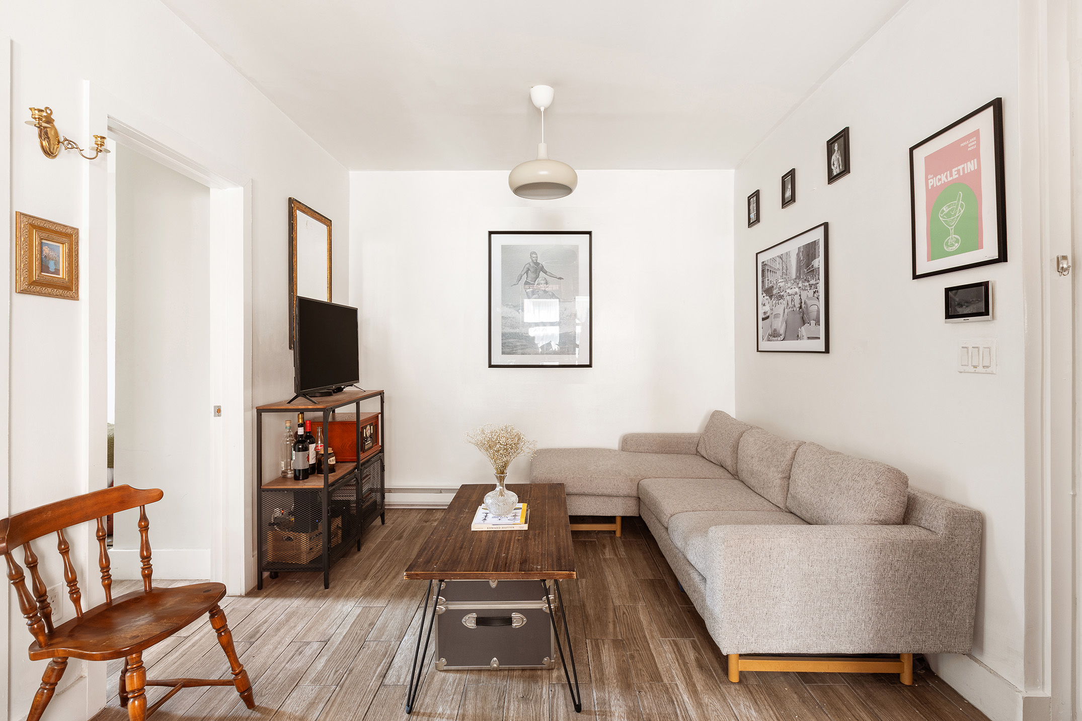 a living room with furniture and a flat screen tv