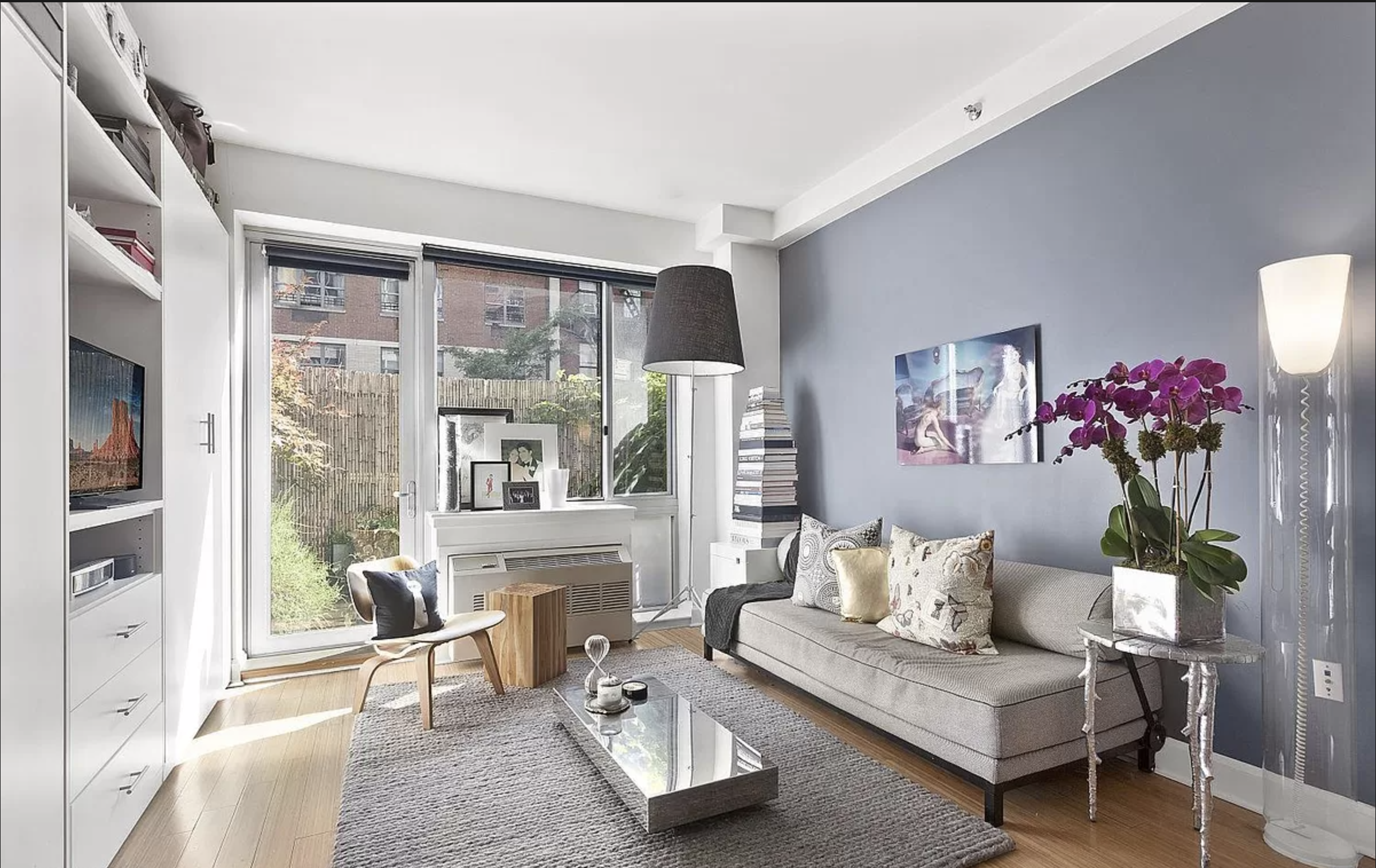 a living room with furniture and a large window