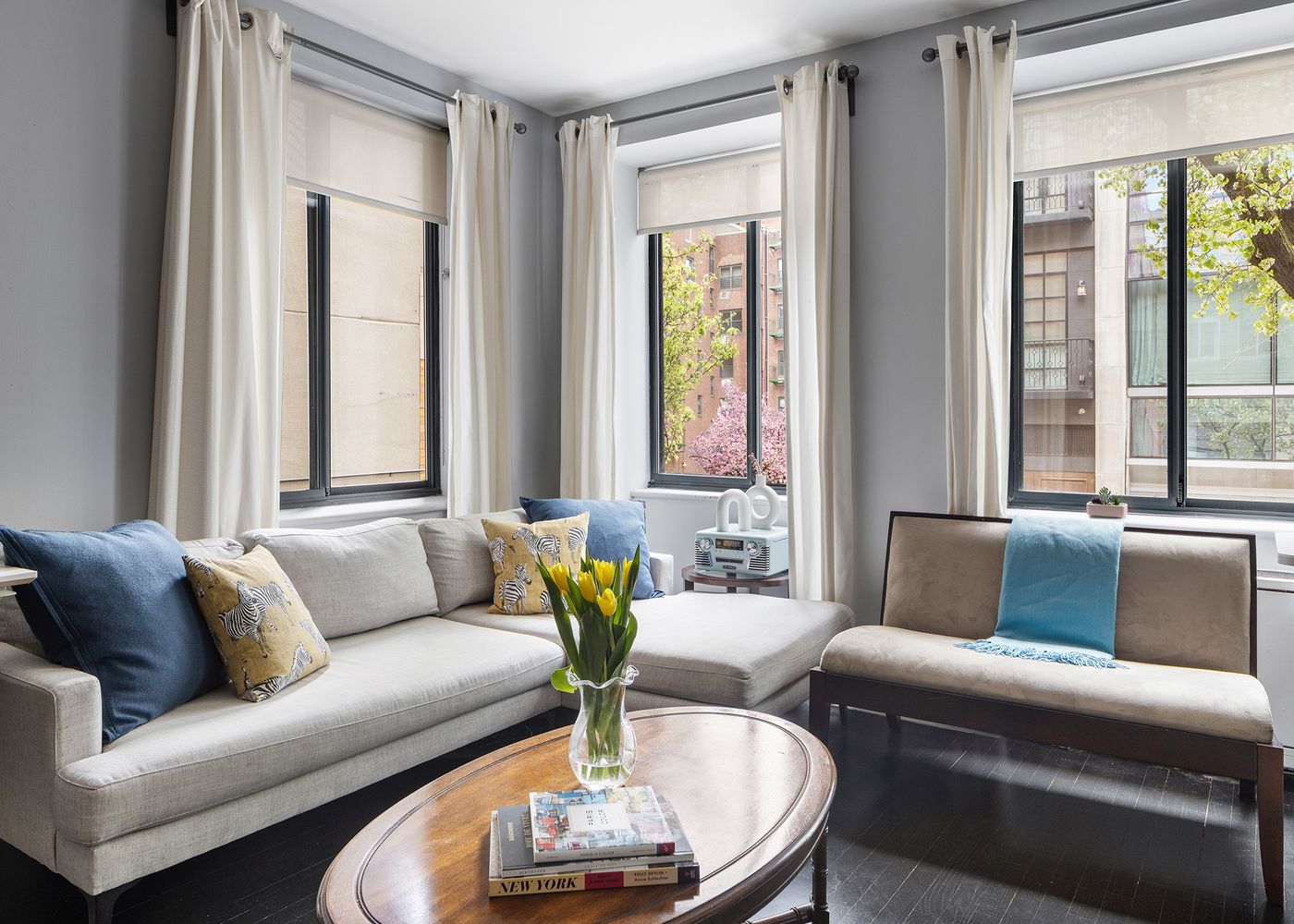 a living room with furniture and a large window